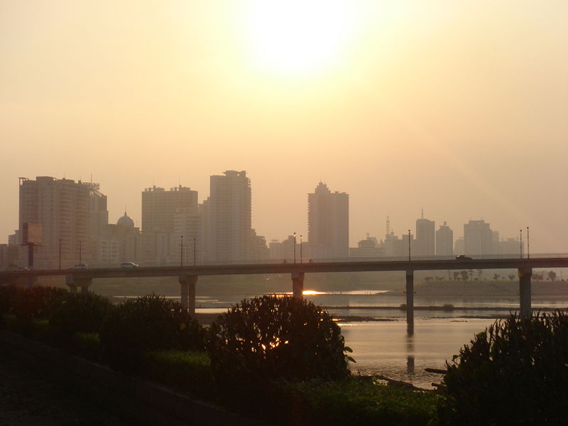 Skyline photograph, w/highway in foreground, of Qingyuan City, …