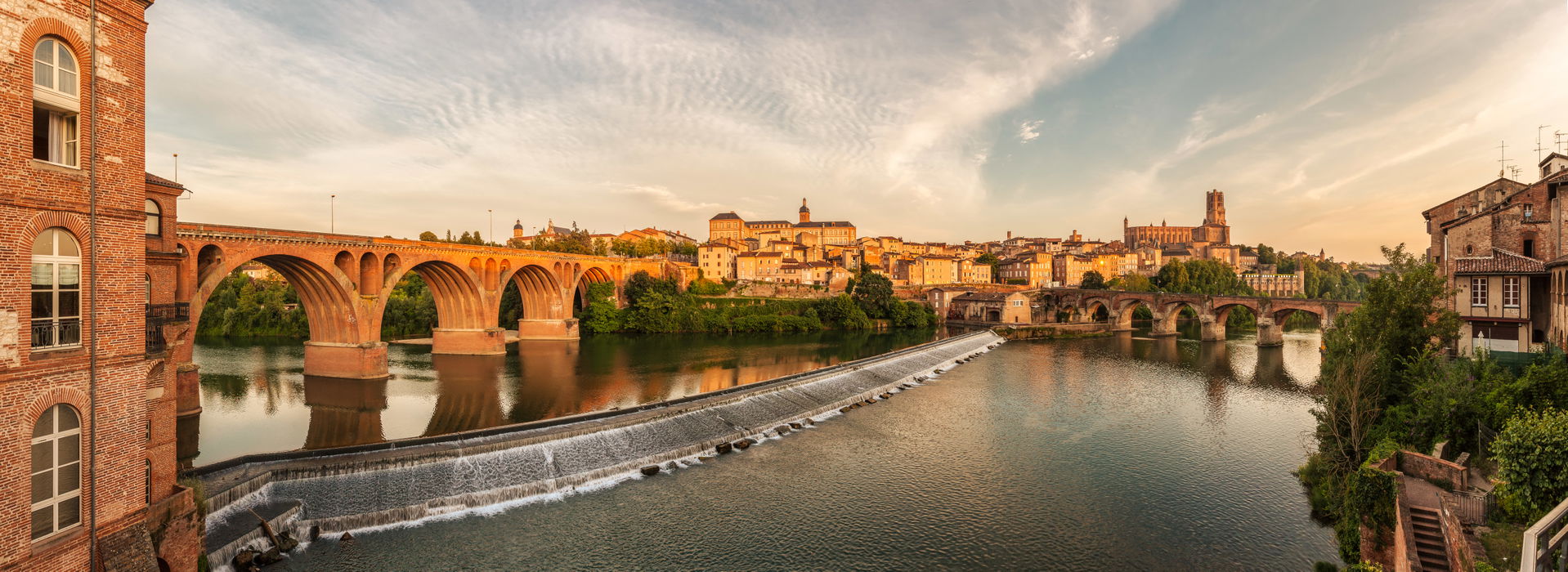 City of Albi at sunset time. This image features the old city a…