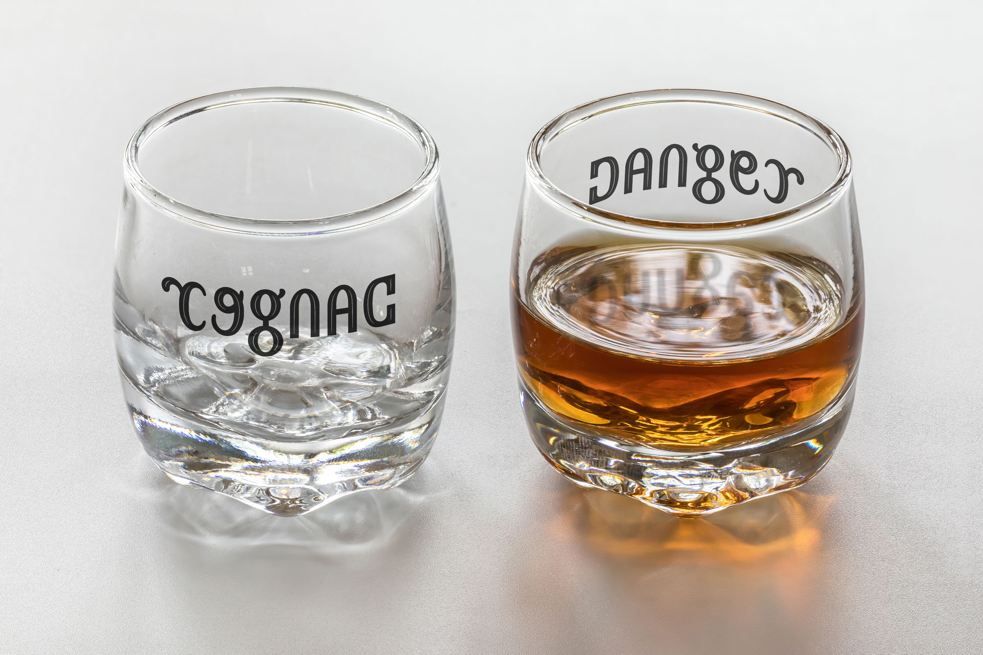 Ambigram Cognac / Danger, mirror symmetry (vertical axis), fro…
