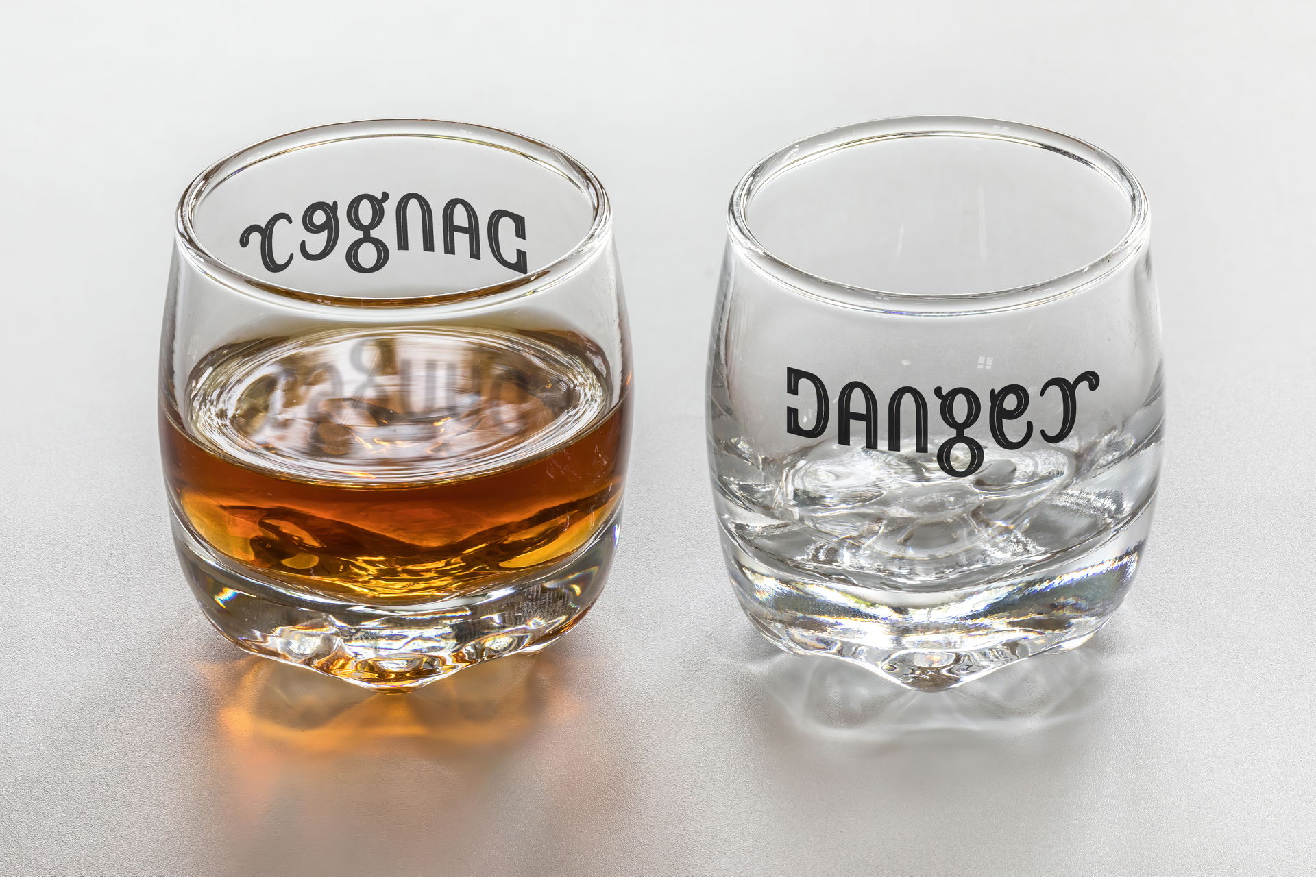 Ambigram Cognac / Danger, mirror symmetry (vertical axis), fro…