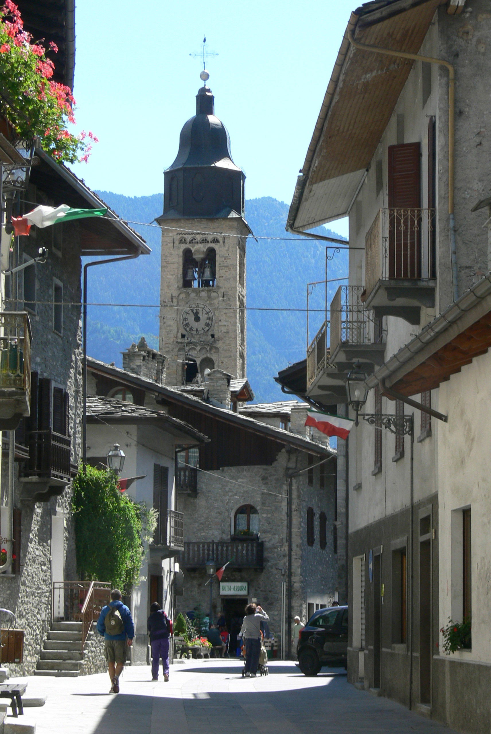 Morgex ( Aosta Valley ). Main street with church tower.