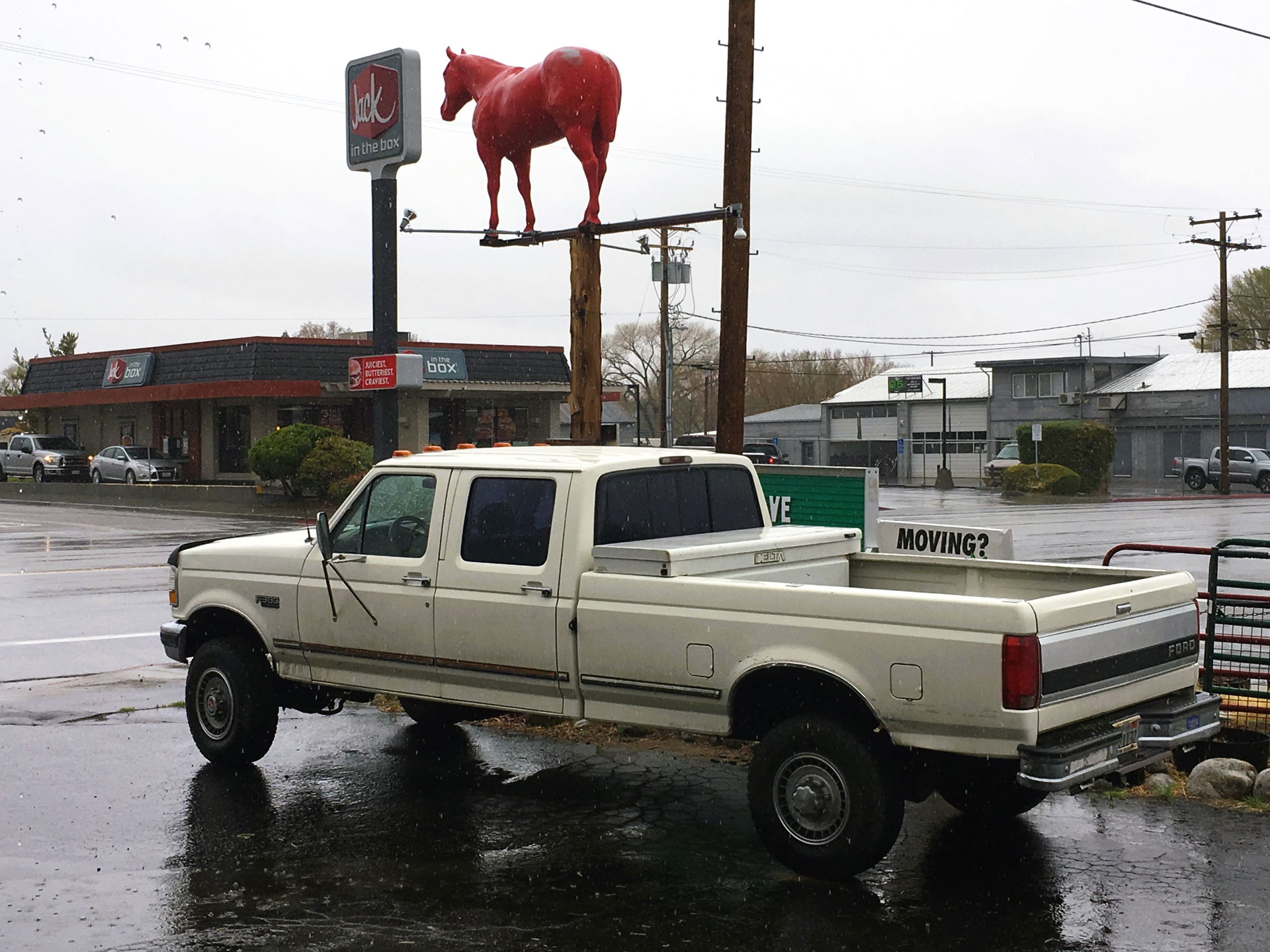 Ford F-350 (1992) and the Red Horse figure at the main street i…