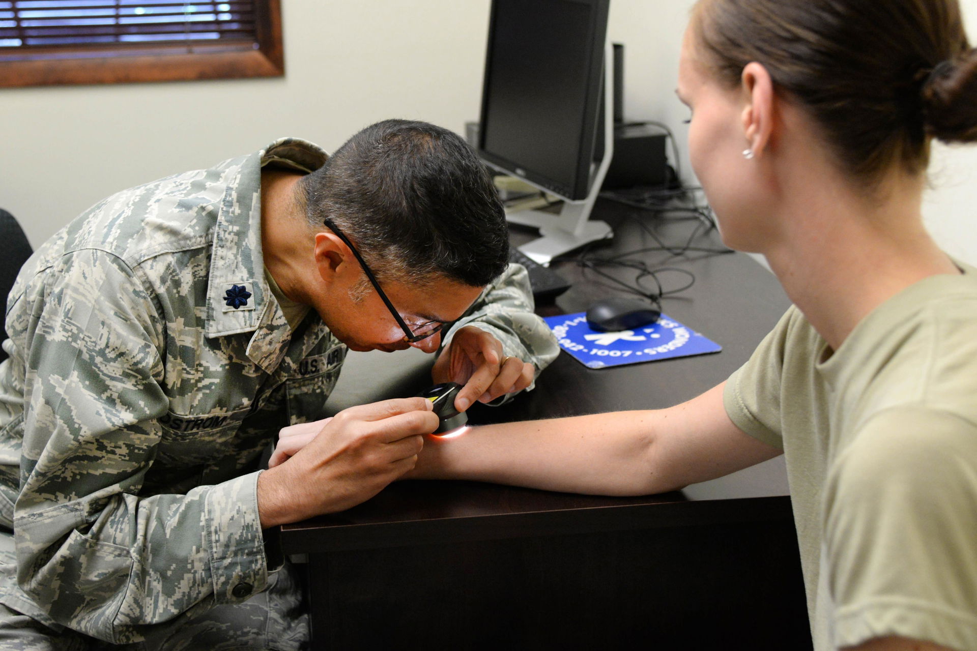 Lt. Col. Paul Bostrom, a board-certified dermatologist who is a…