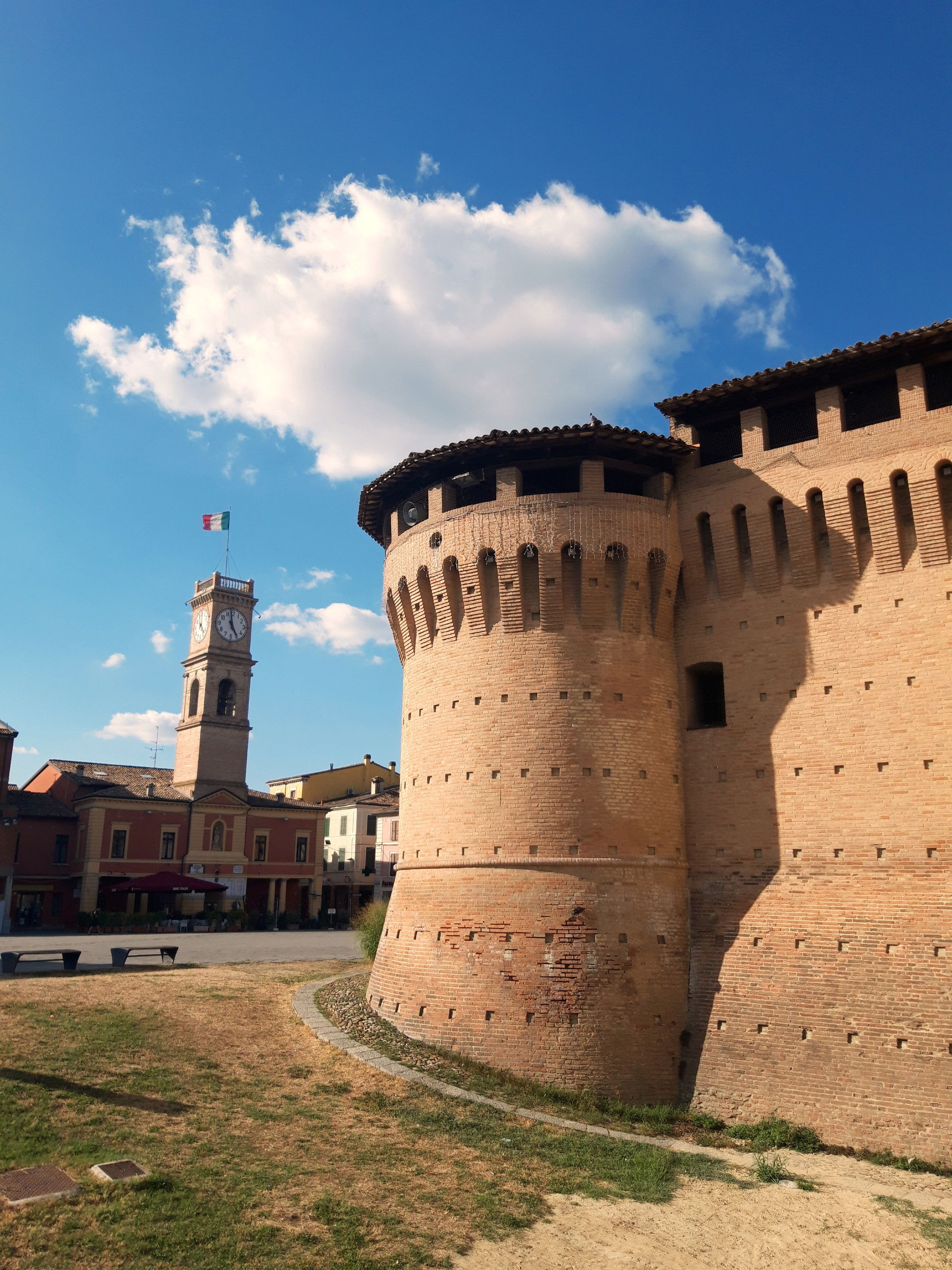 A side of the Rocca and Piazza Garibaldi in Forlimpopoli (FC), …