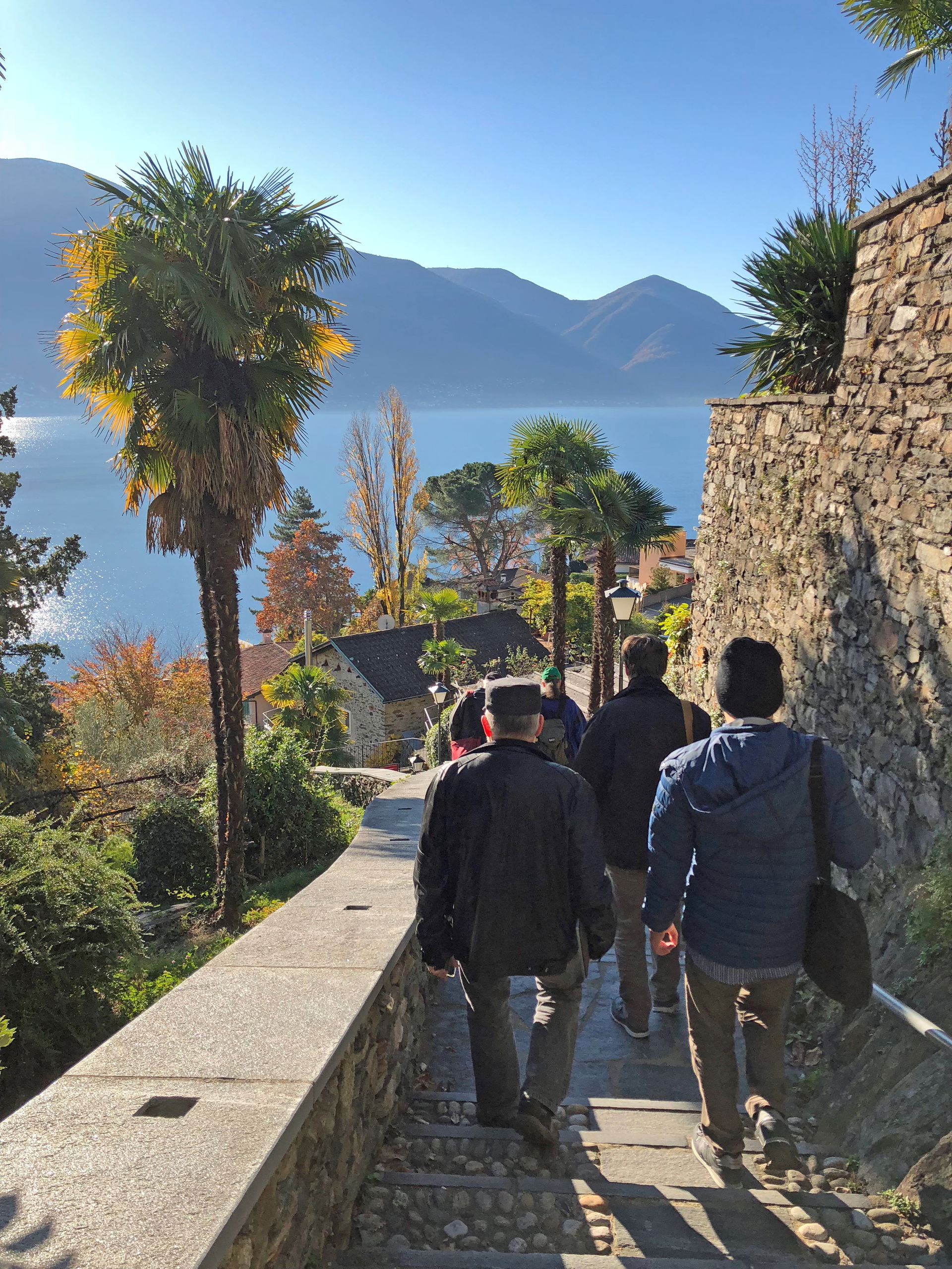Wikipedians going down a steep alley in Ascona – GLAM on tour M…
