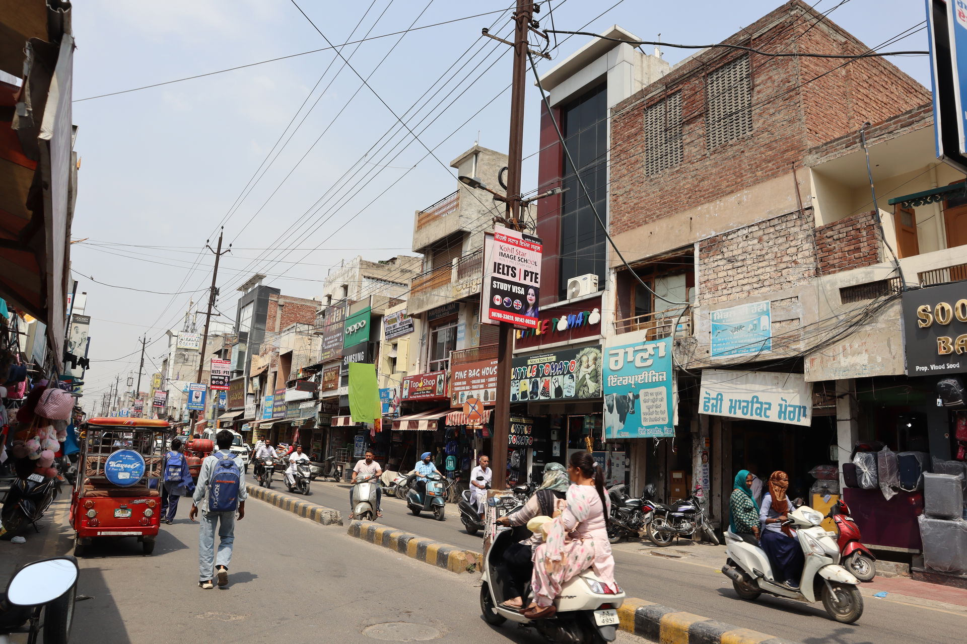 Photograph of a busy street located within Moga city, Moga dist…