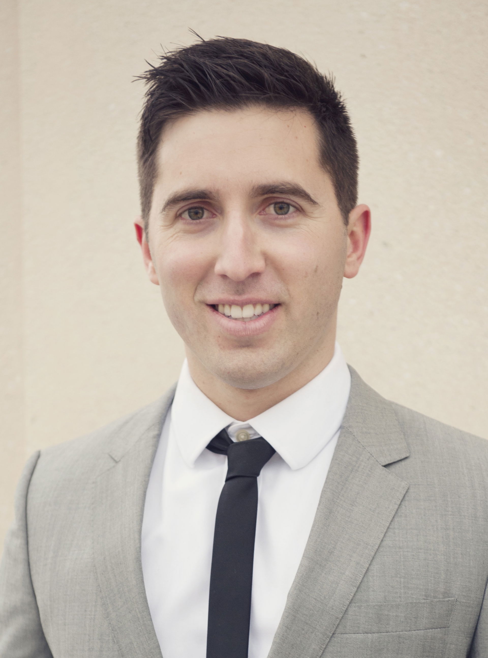 Simple head and shoulders shot in a suit.