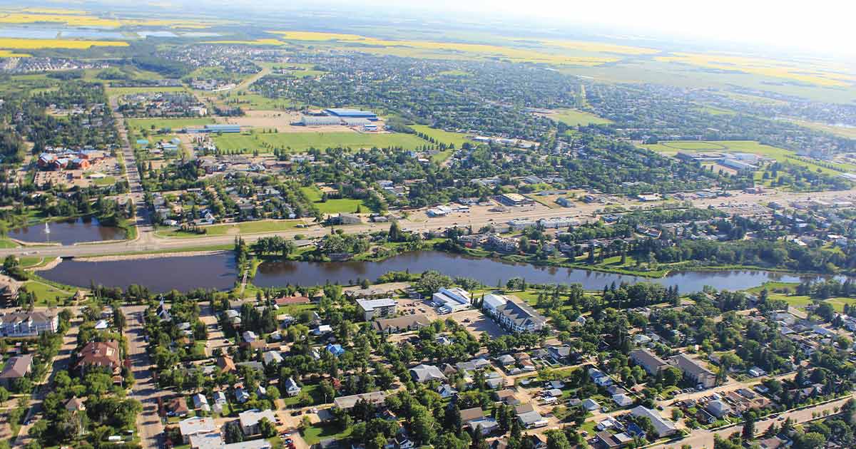 Aerial view of Camrose, Alberta with Mirror Lake in the foregro…