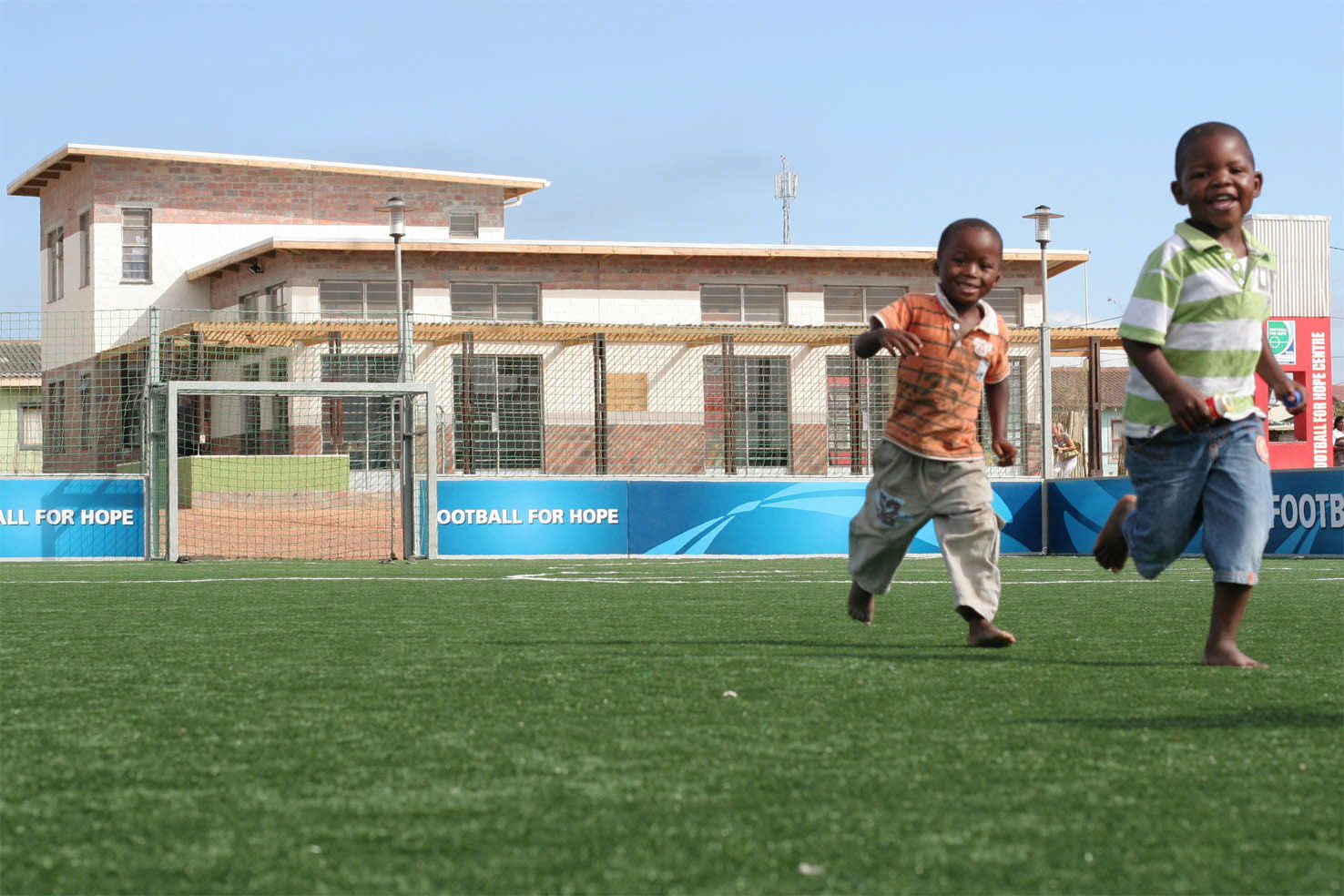 Children at play on the field at Football for Hope's first cent…