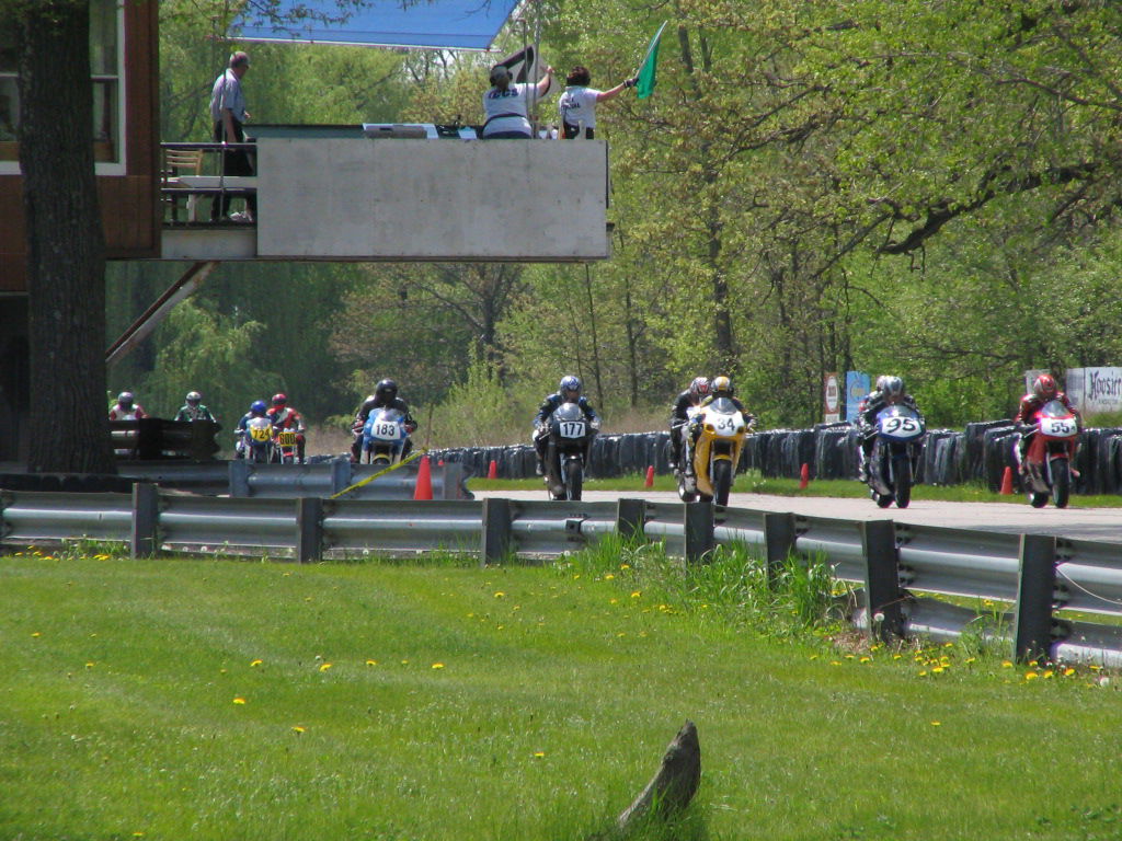 Motorcycles starting a race at the flagstand at w:Blackhawk Far…