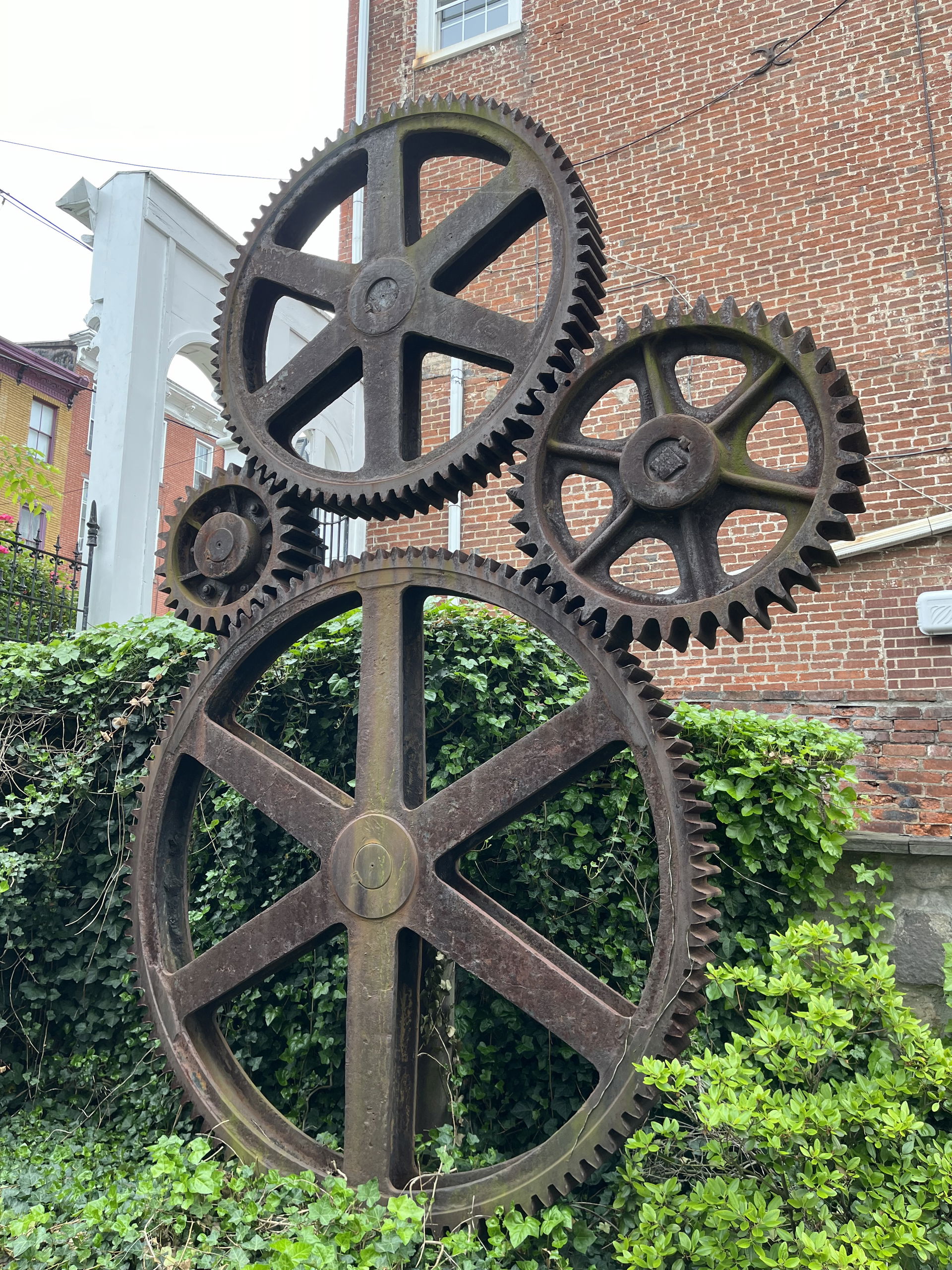 A couple of massive gears assembled in some sort of art piece o…