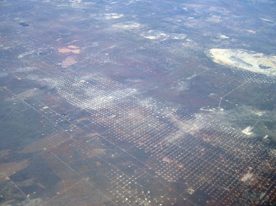 Oblique air photo of Wickett, Texas, facing northeast, showing …