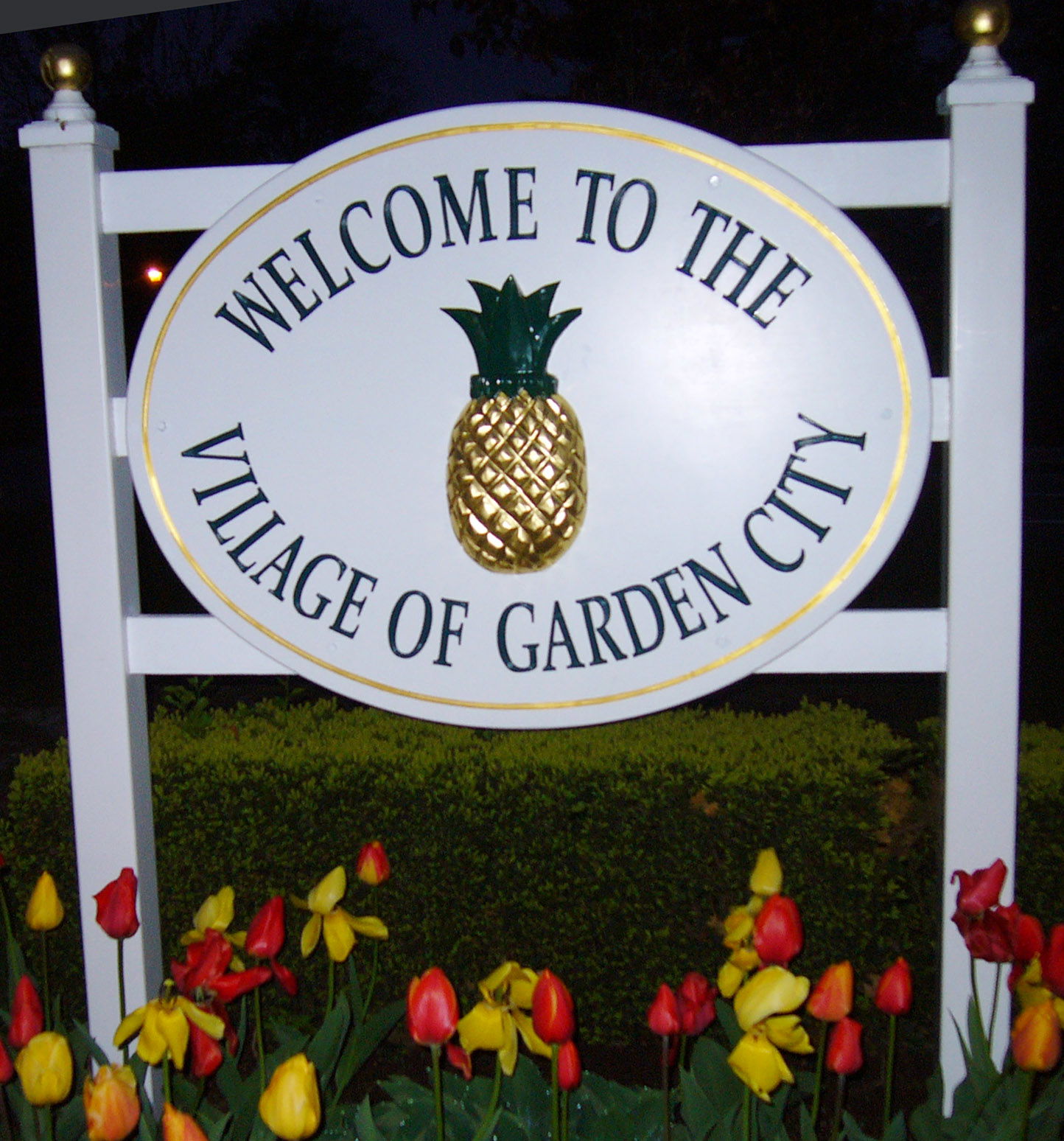 Welcome sign of Garden City, New York, which features a pineapp…