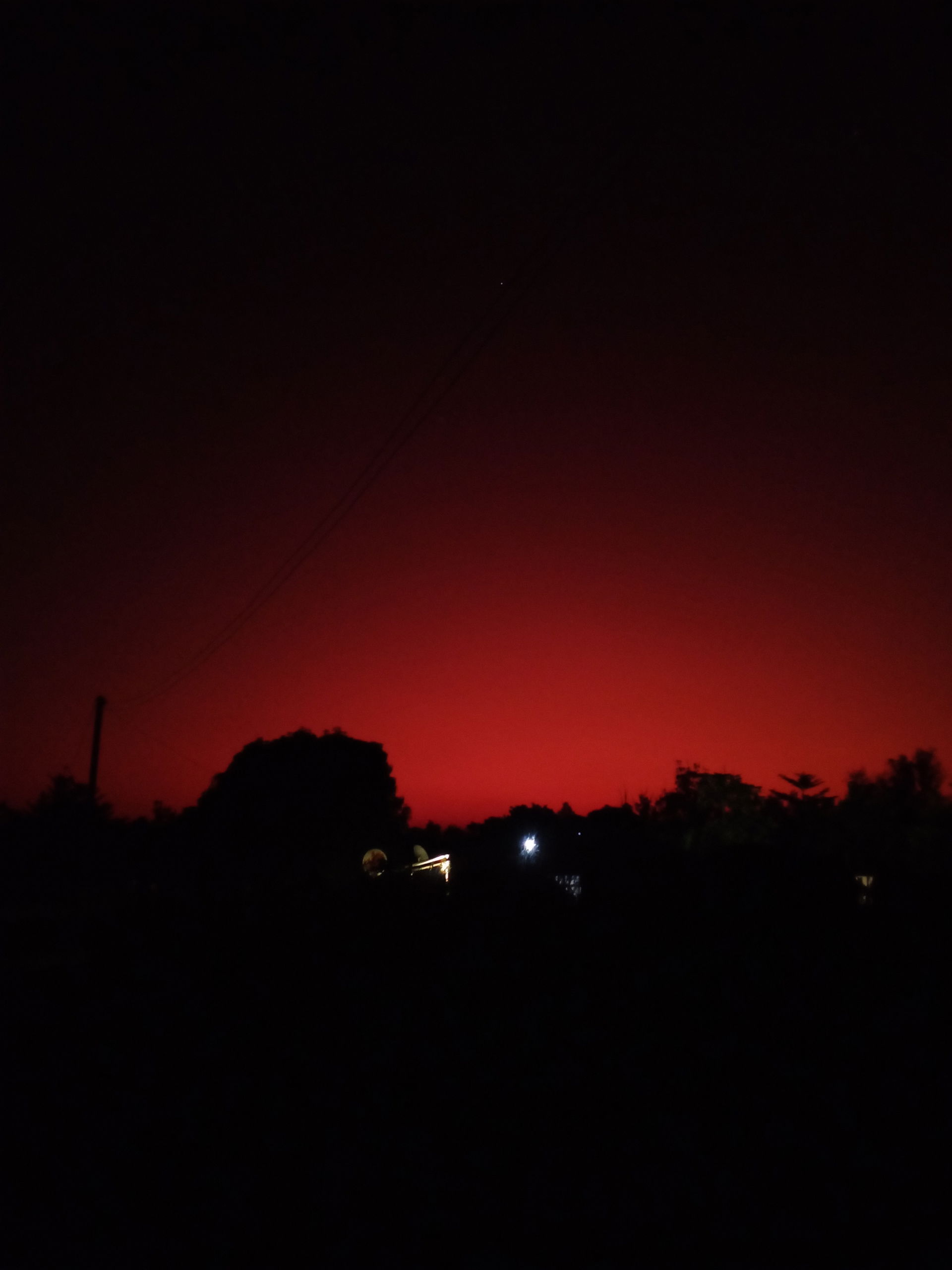 The sun setting over Kaoma township homes.