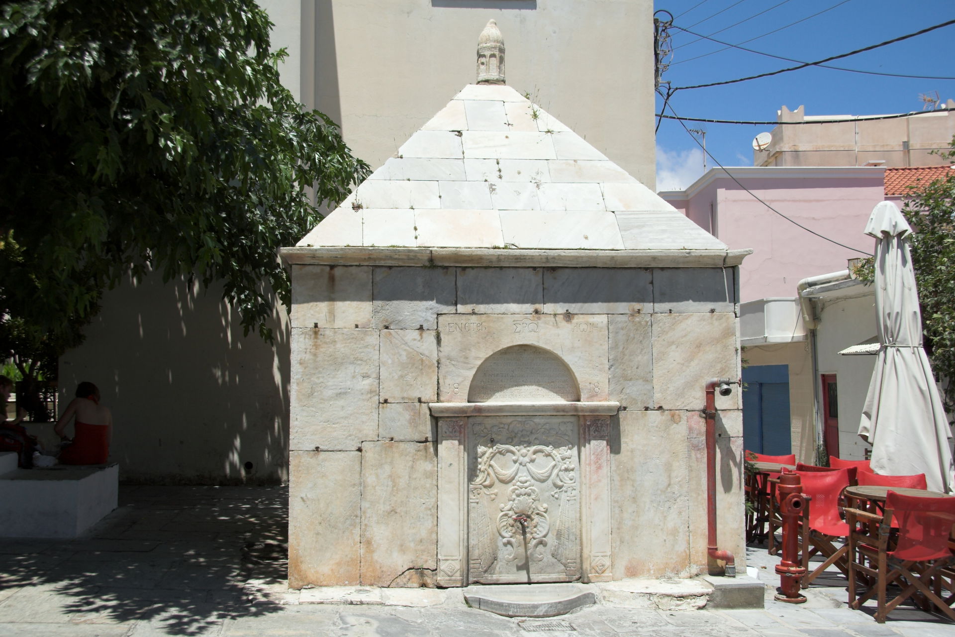 Fountain with inscriptions from 1818 in the old square of the C…