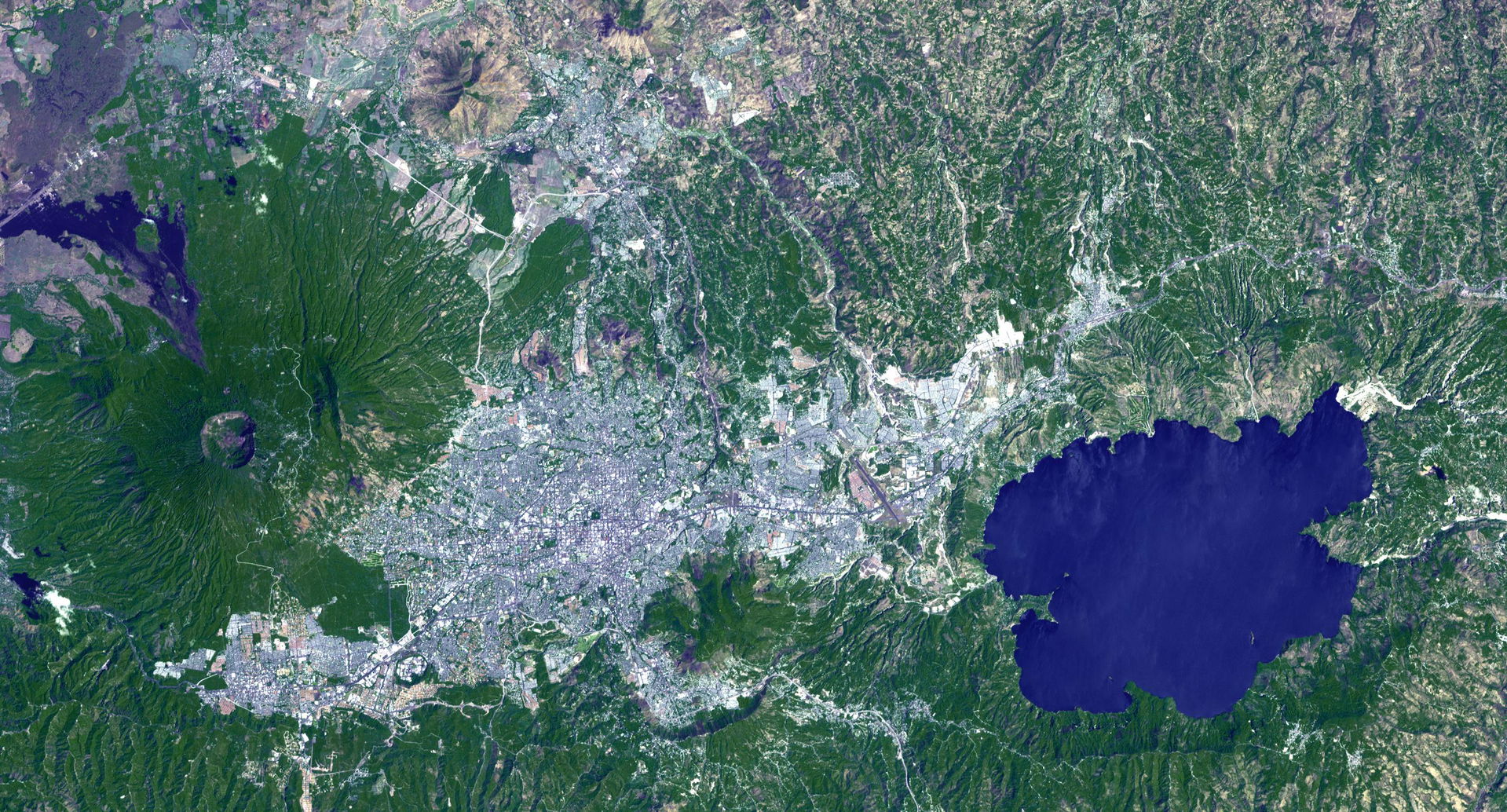 Lake Ilopango is a crater lake which fills a volcanic caldera i…