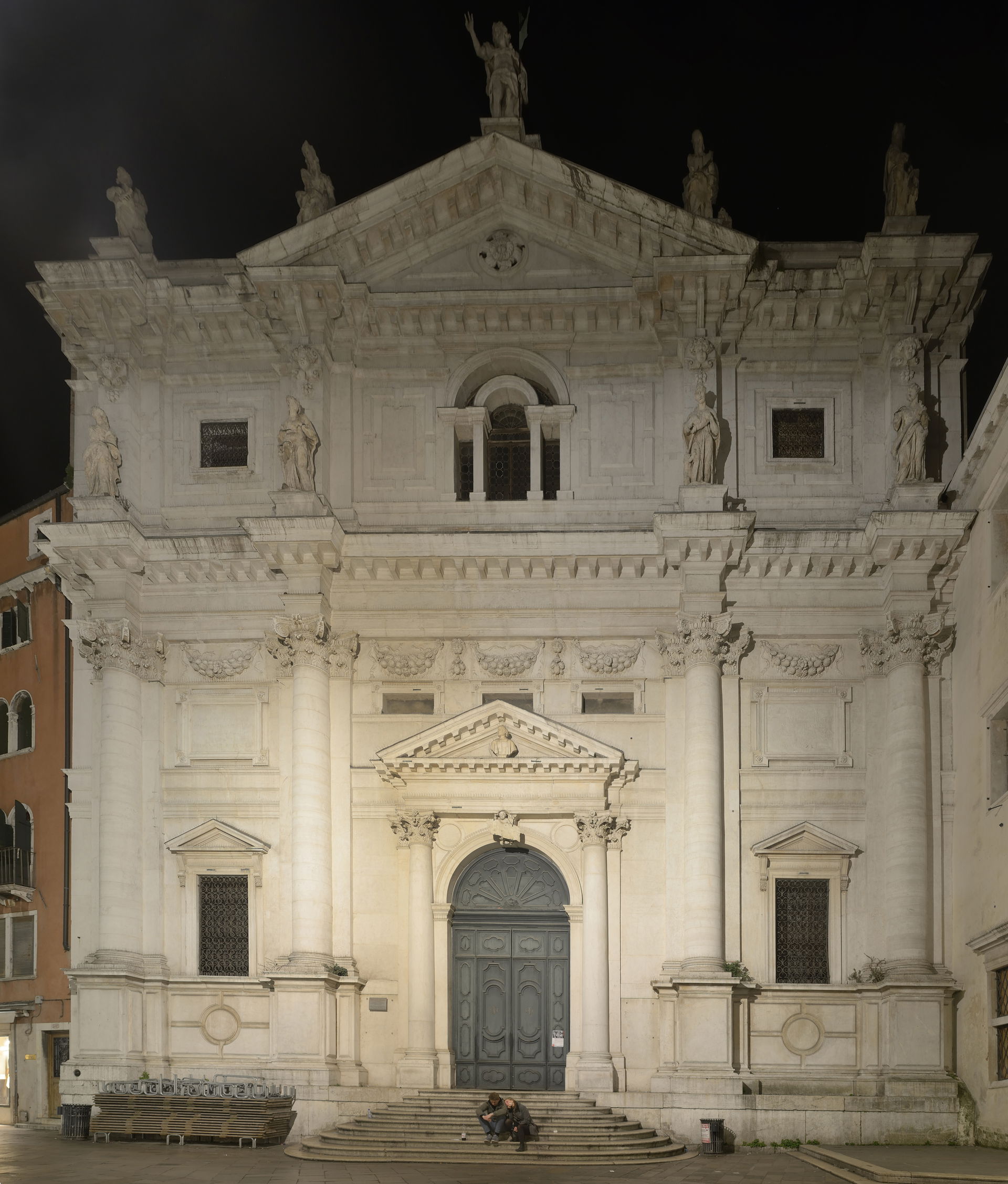 View at night of the main facade of the San Salvador church, in…