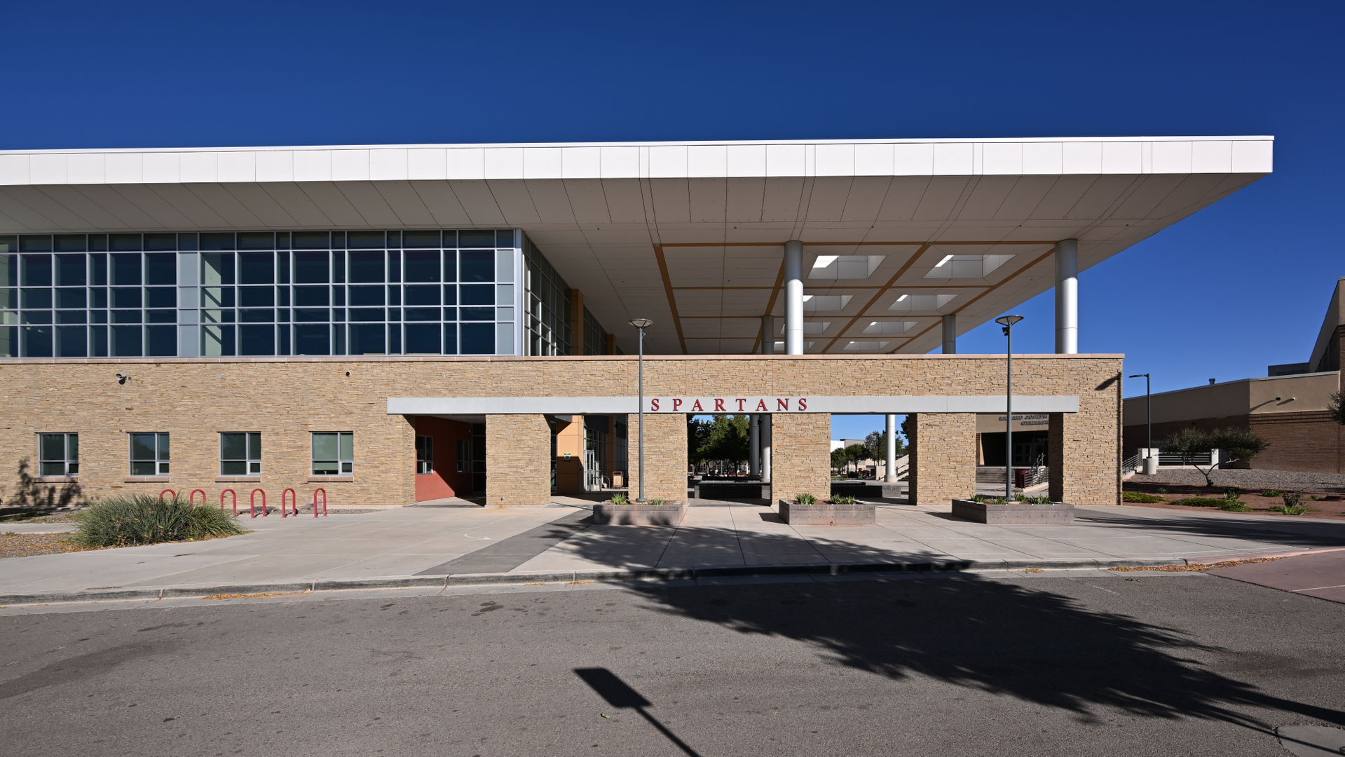 The entrance to Bernalillo High School with a large overhang an…