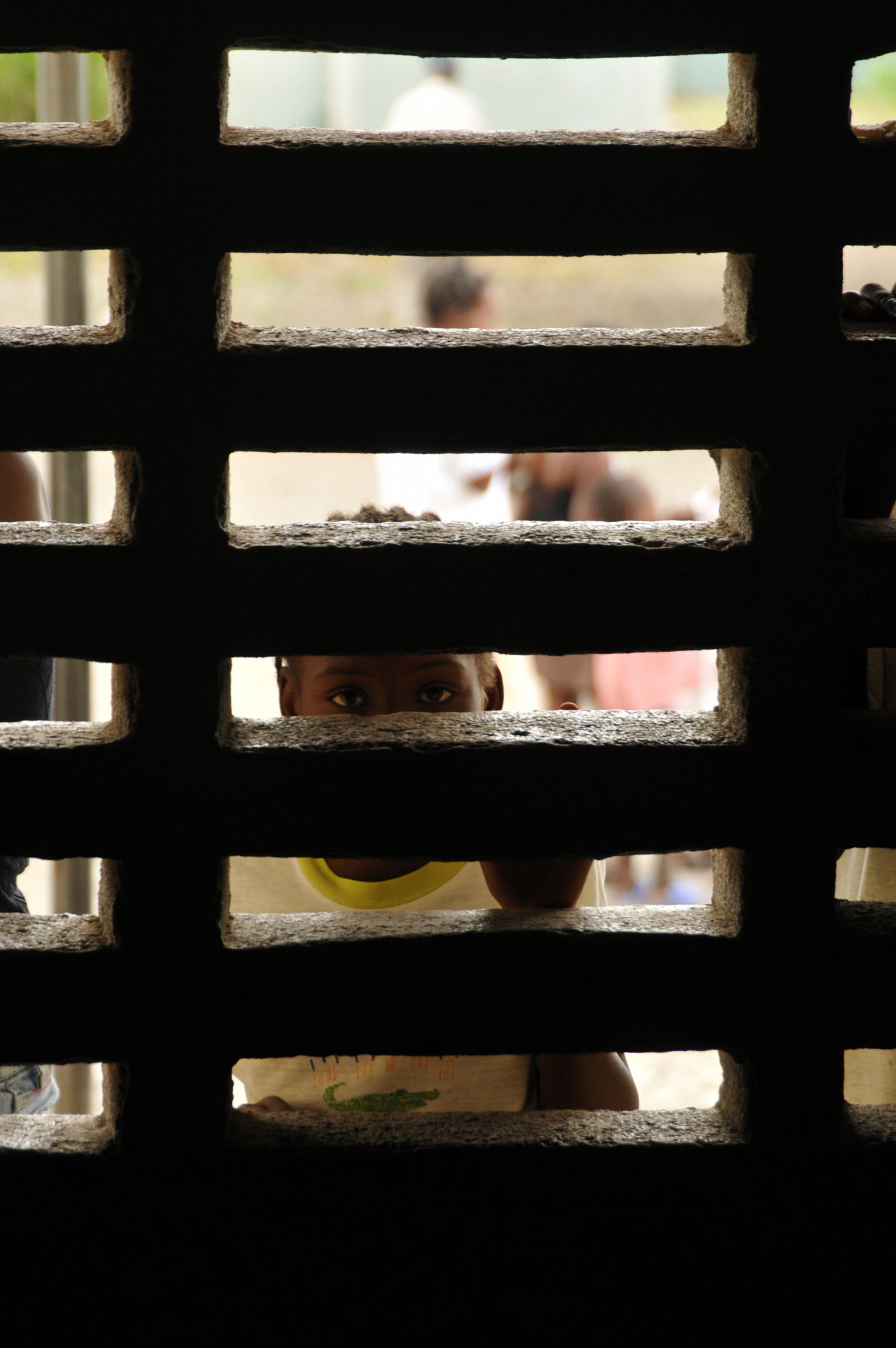 A local child looks on as members from the amphibious assault s…