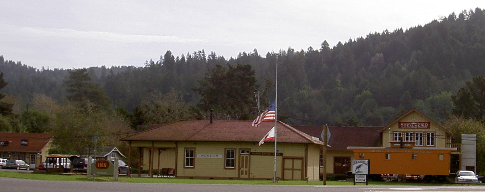skyline of Duncan's Mills, California, with museum and flagpole…