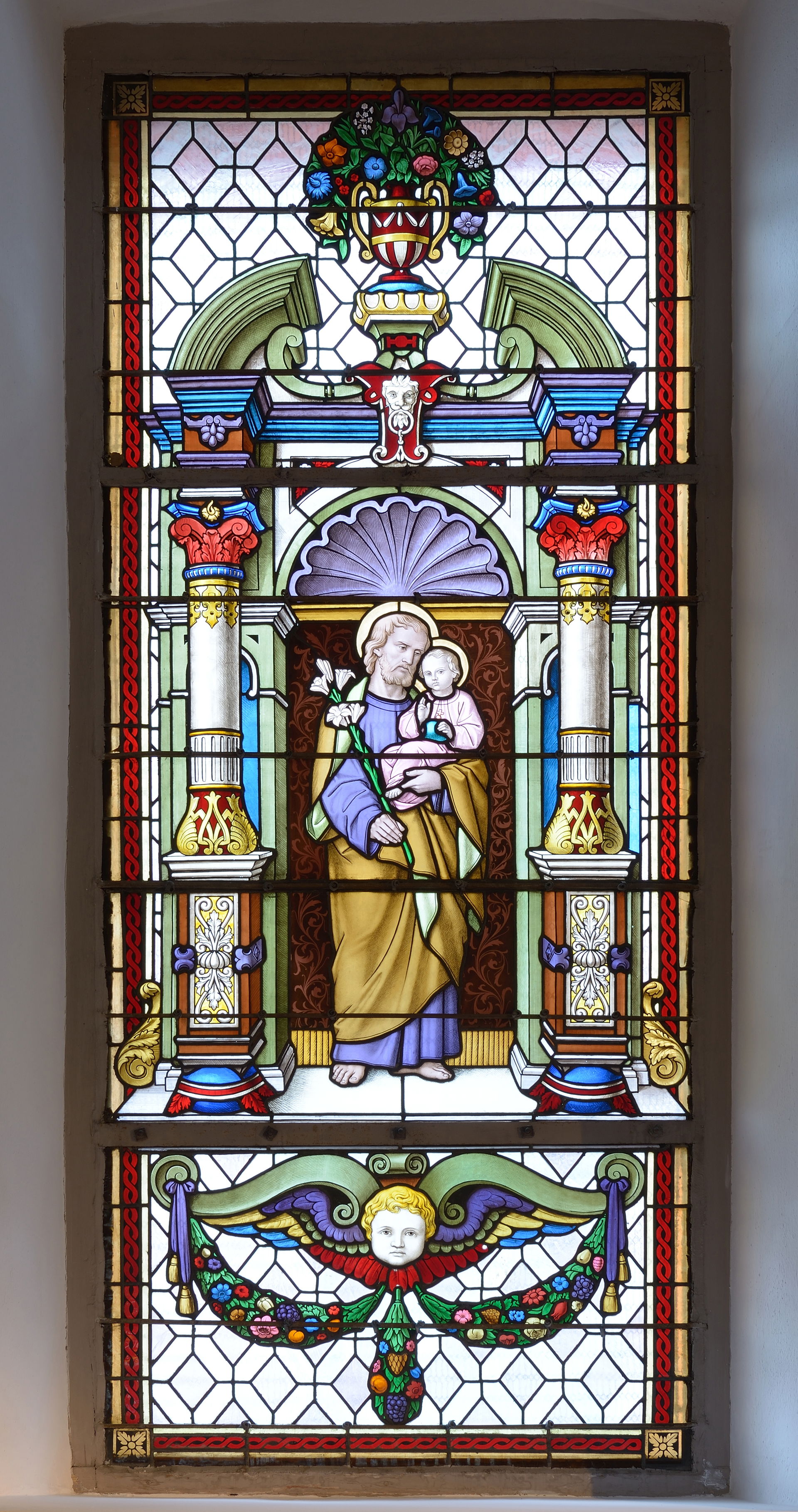 Saint Joseph on a stained glass window in the Saint Antony chur…