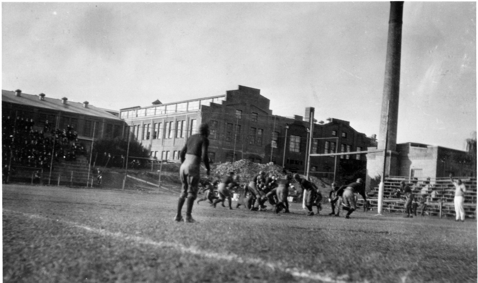 The 1921 Trinity College football team playing a football game …