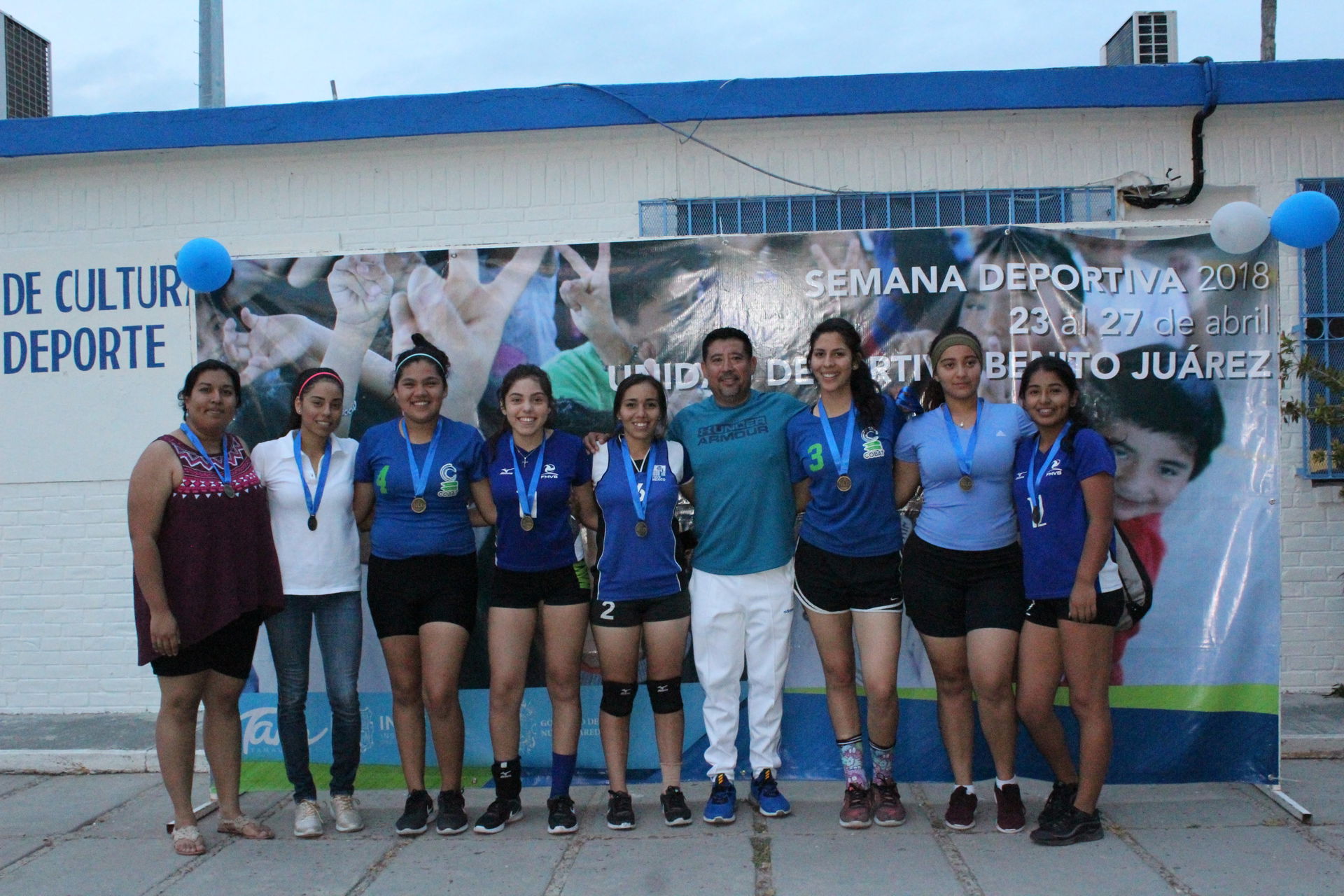 The highschool COBAT women's team, led by their coach Erika Edi…