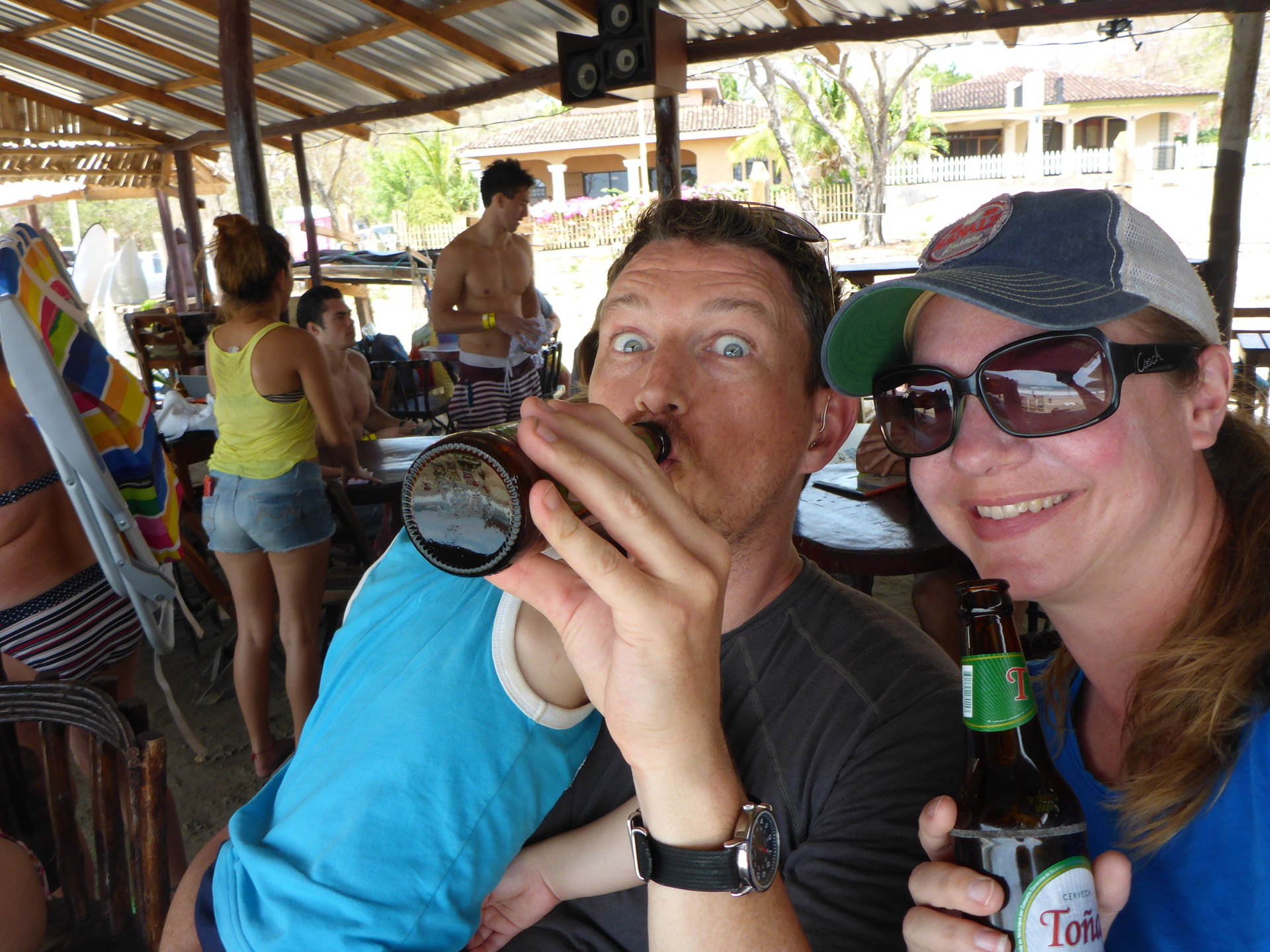 Taking a beer break while Enzo naps and watching the surfers at…
