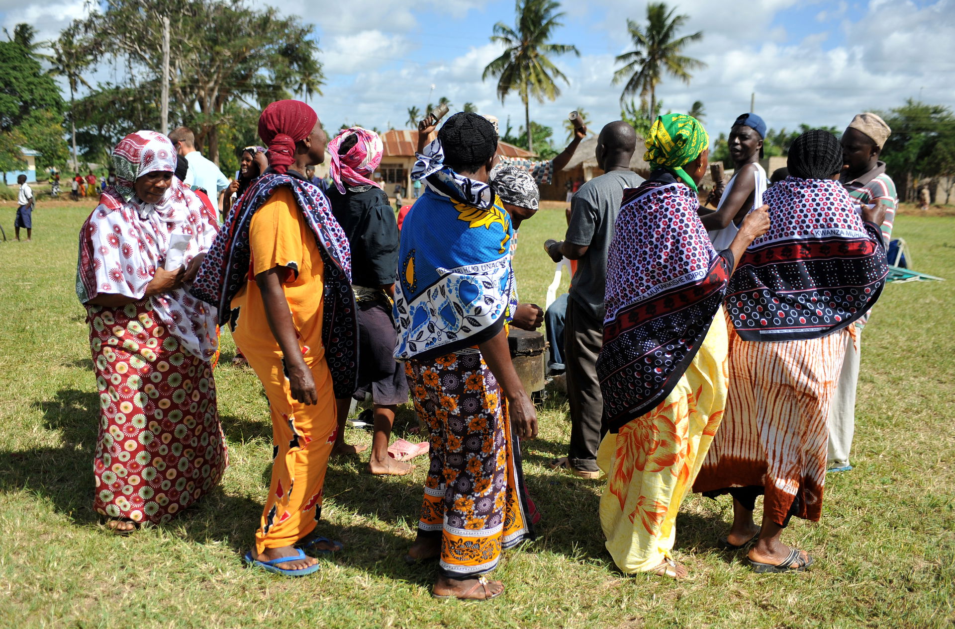 Local village women dance in celebration during the opening cer…