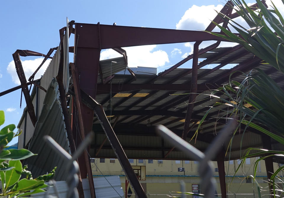 Damaged structure over a basketball court in Cayey, Puerto Rico…