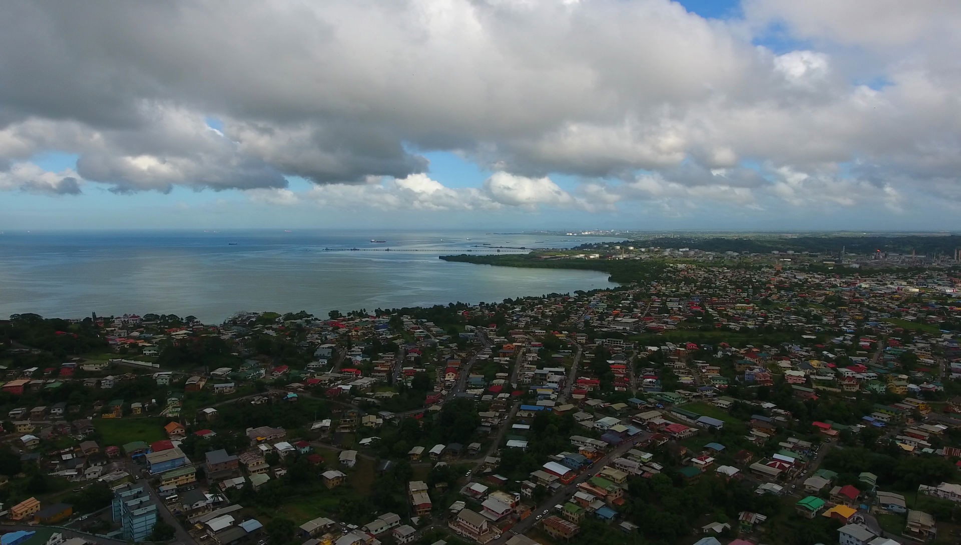 Marabella, San Fernando, Trinidad and Tobago.
In the background…