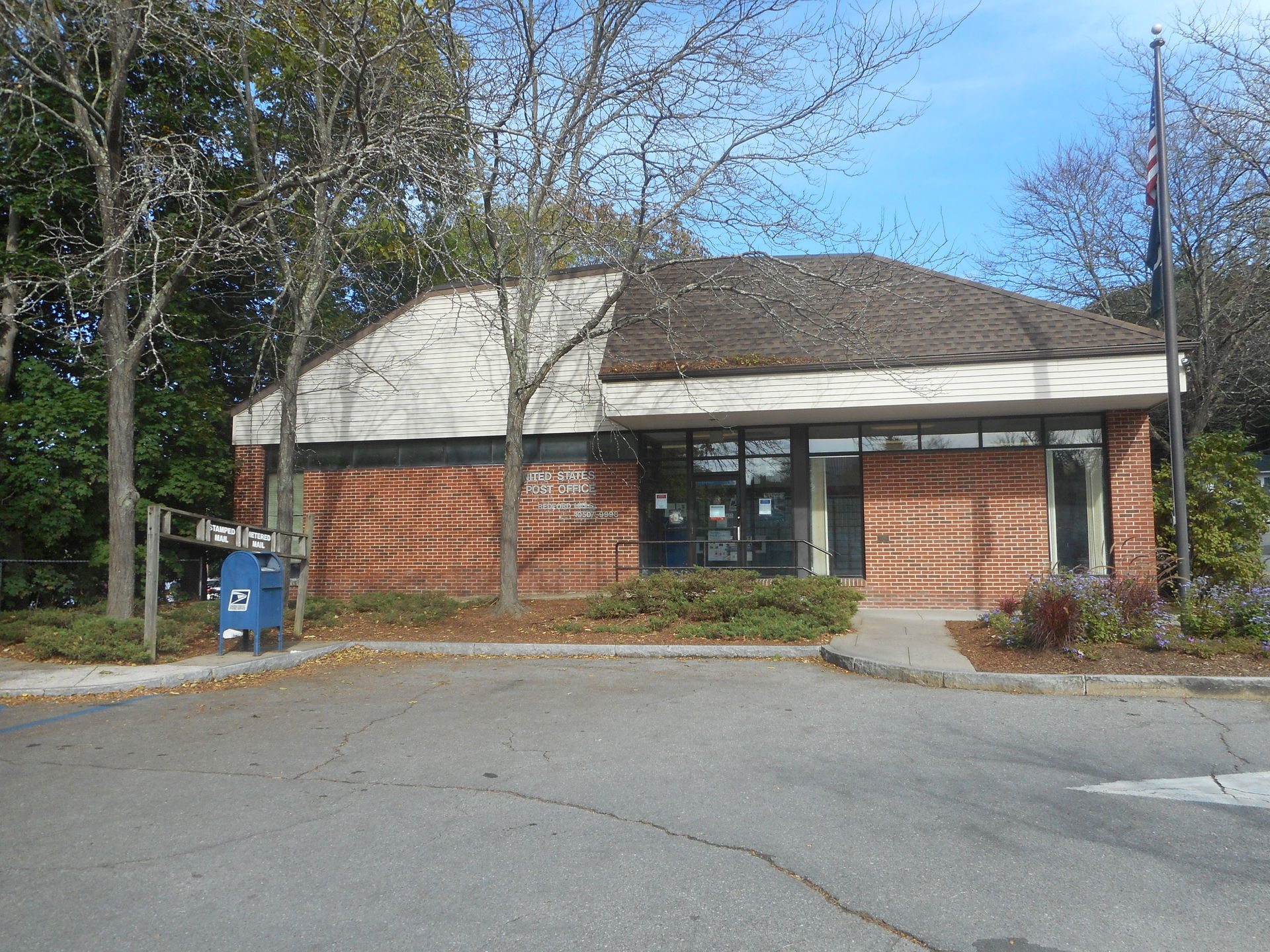 The modern-looking United State Post Office building in Bedford…