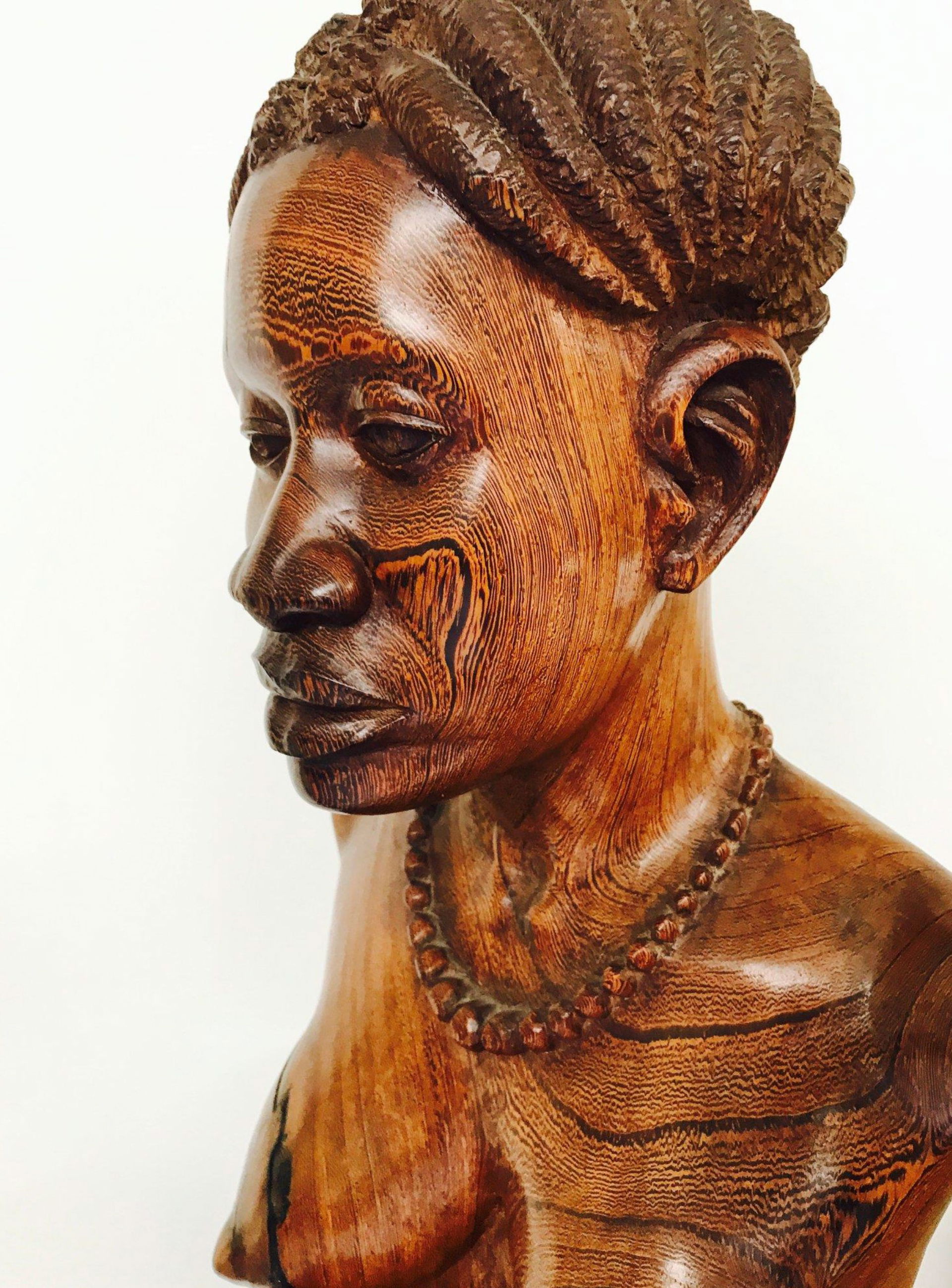 Muta Mayola detail of a wenge bust signed Mayola and located 79…