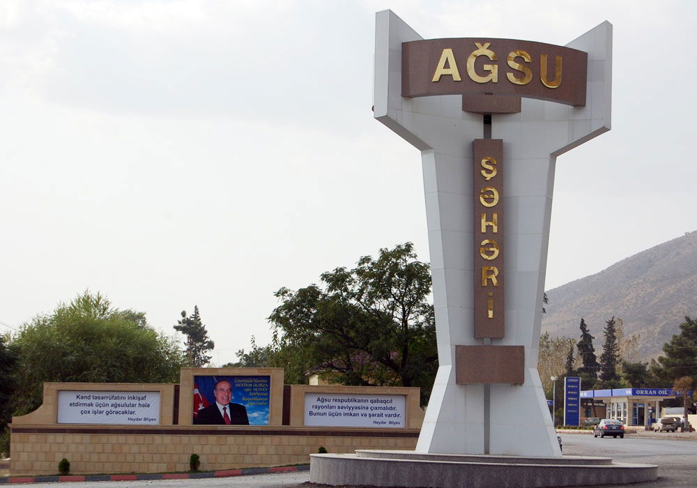 Road sign at the entrance to Aghsu city. Republic of Azerbaijan.