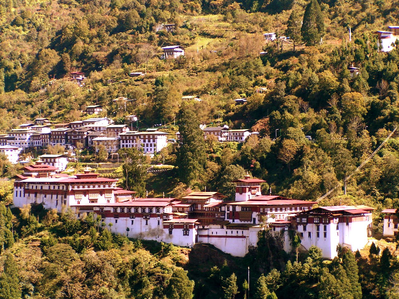 A panoramic view of the Trongsa Dzong — within Trongsa town set…