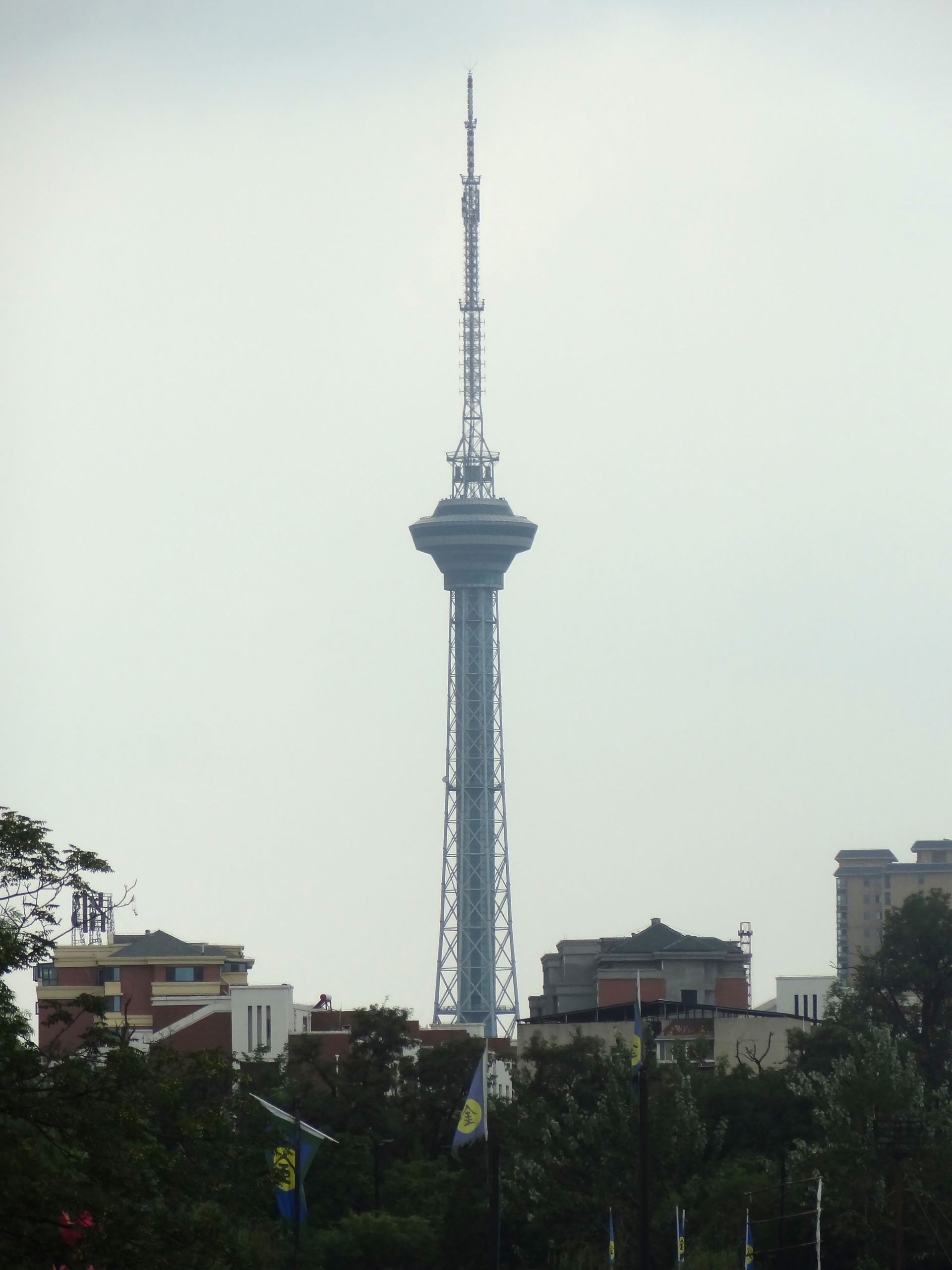Kaifeng TV Tower against an overcast sky, photo taken from Mill…