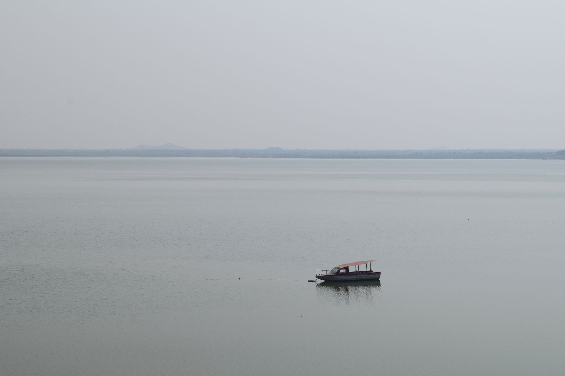 A motor boat on the waters of Manair Reservoir, Karimnagar, Ind…