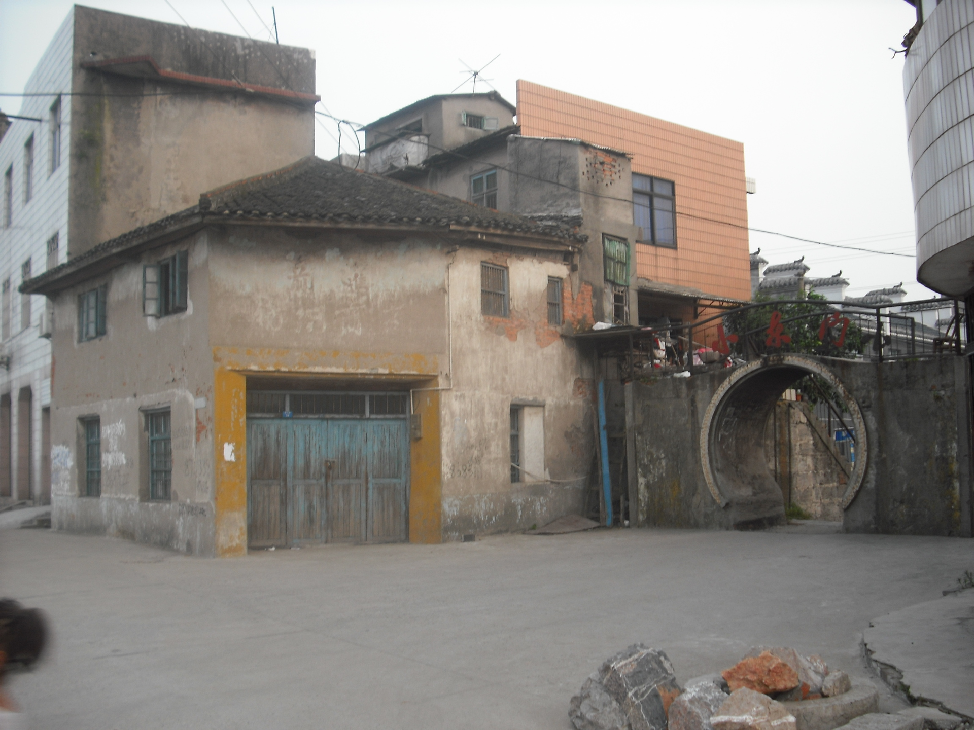 the vice-east gate and qianjin fabric store in Zhicheng town, Y…
