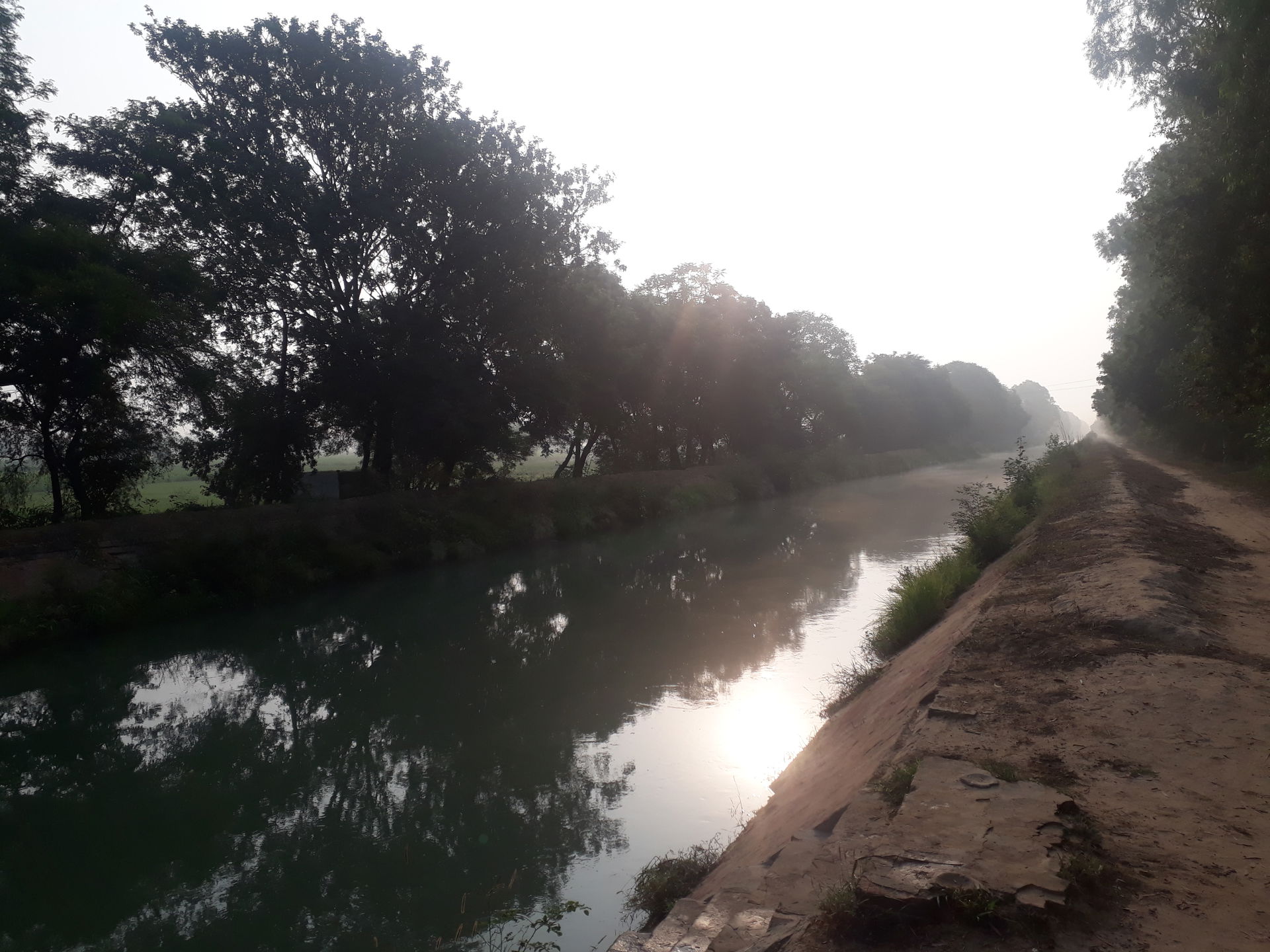 This photo is passing through a village named Takhtmal, a canal…