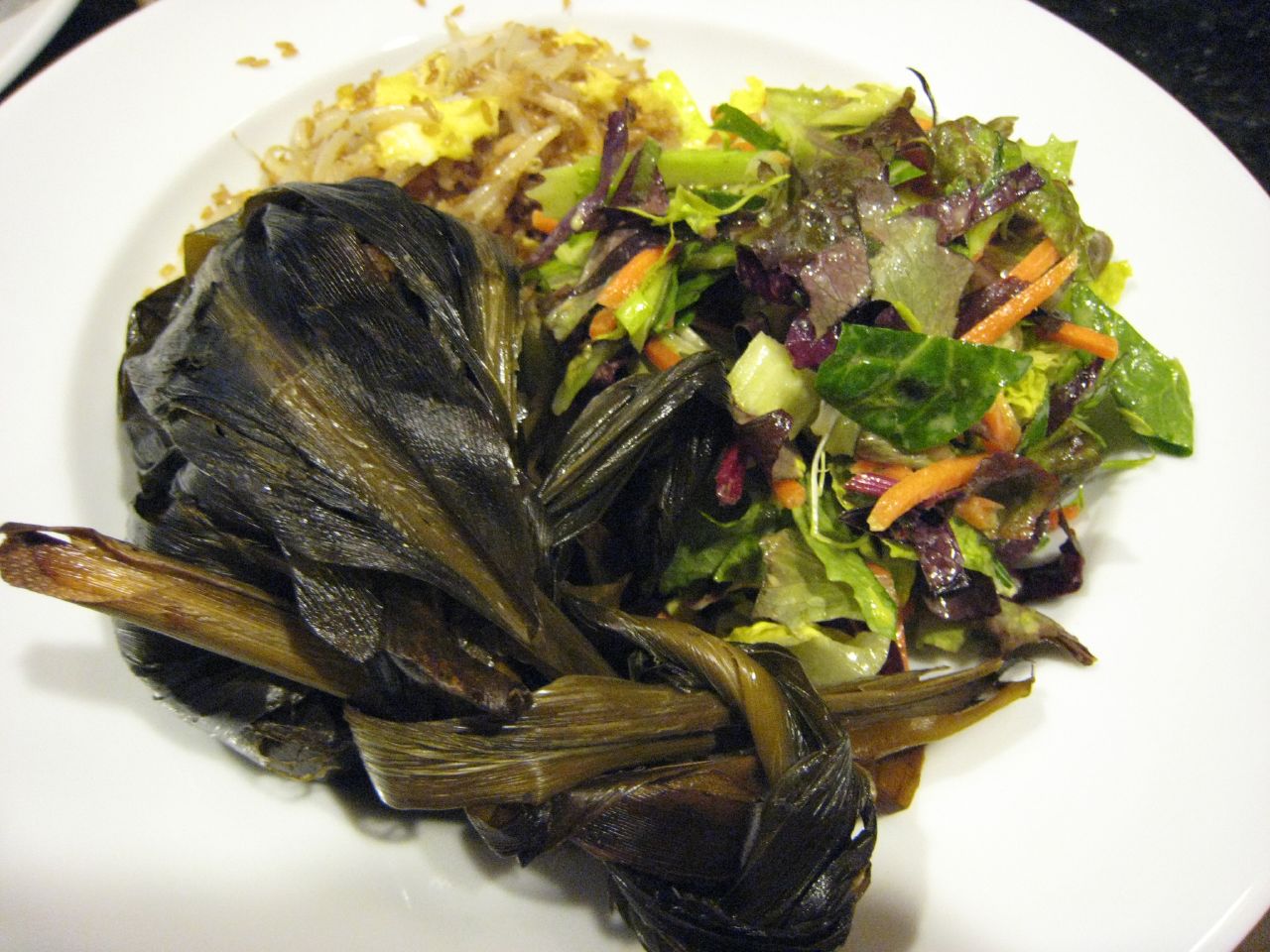 Lau Lau with fried rice, bean sprouts and dark green salad