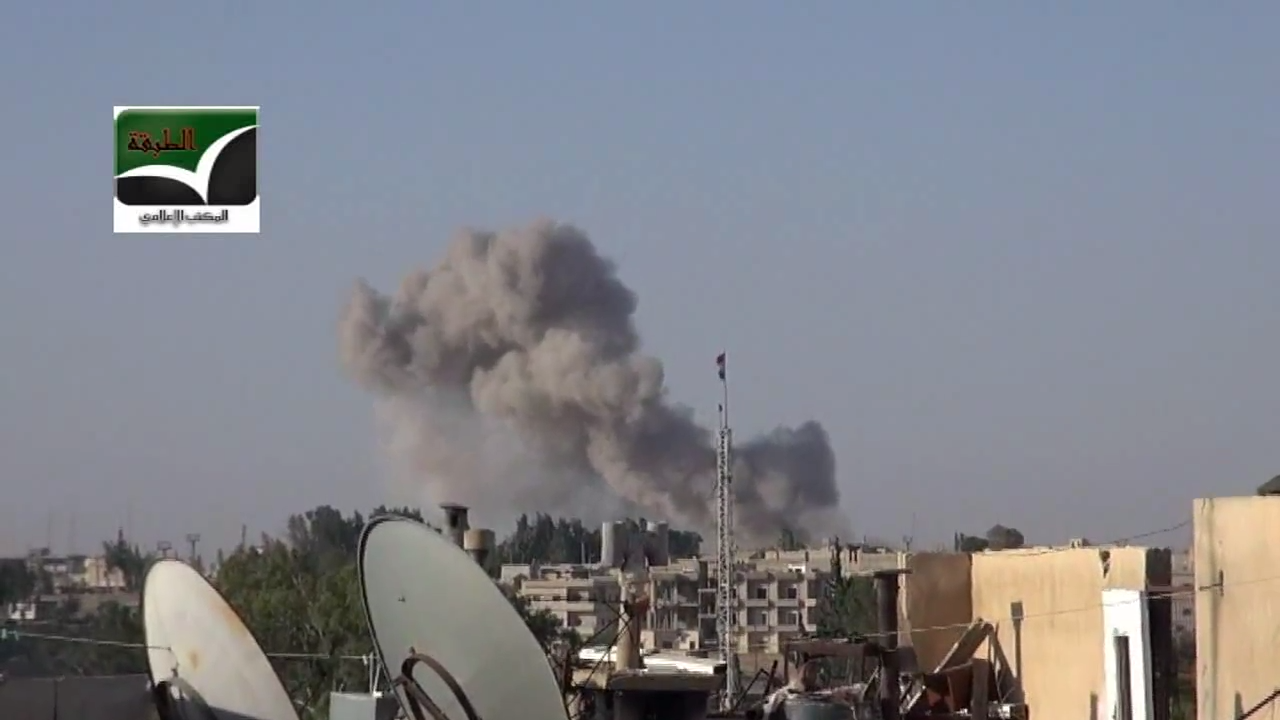 Smoke rises in Tabqa after the city was hit by a Syrian Air For…