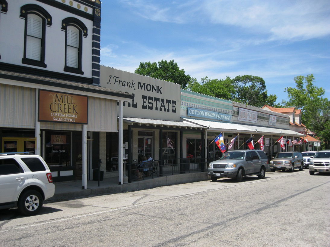 Photo shows stores along Holland Street on the courthouse squar…