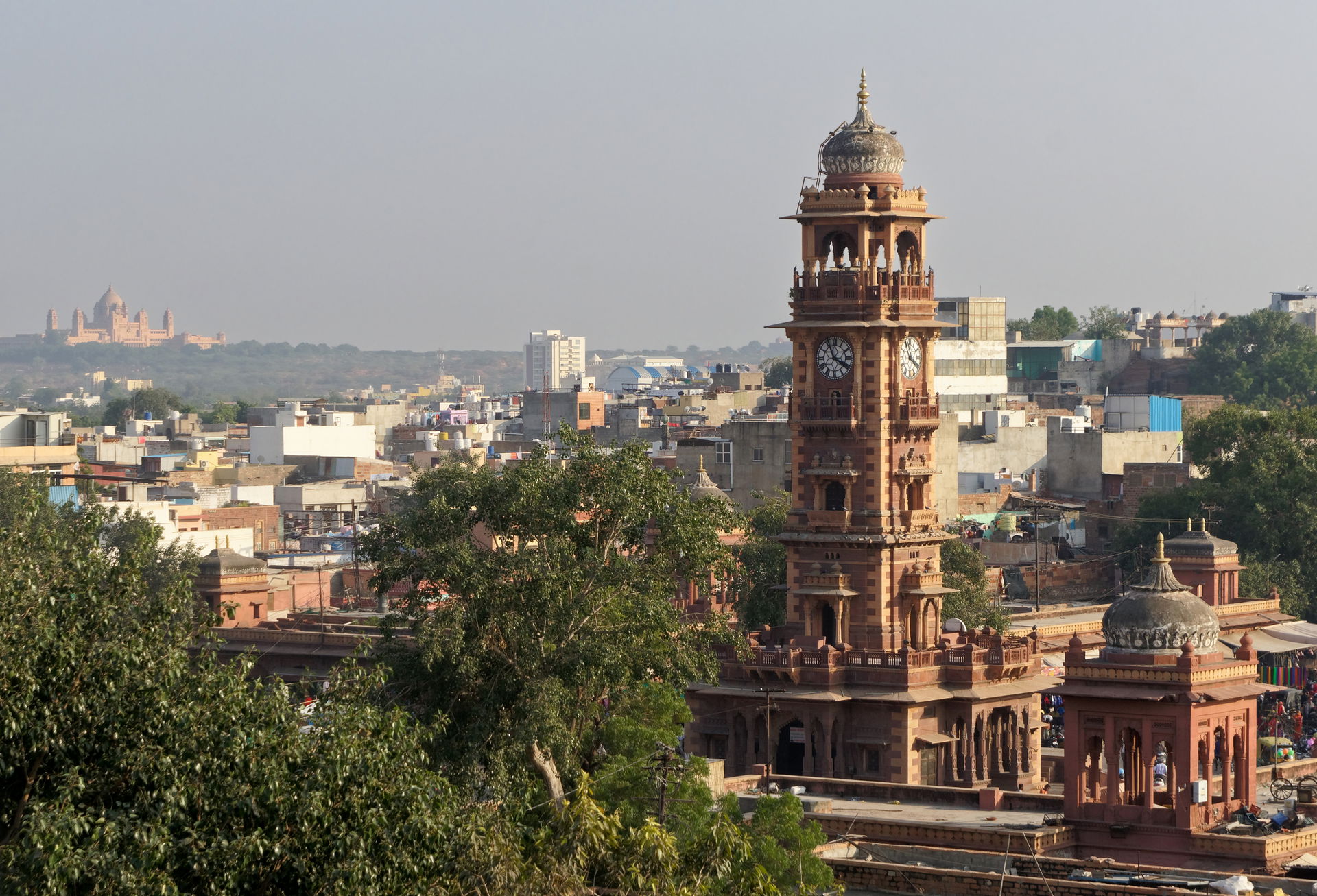 Rooftop view of Jodhpur: Ghanta Ghar on the right, remote Umaid…