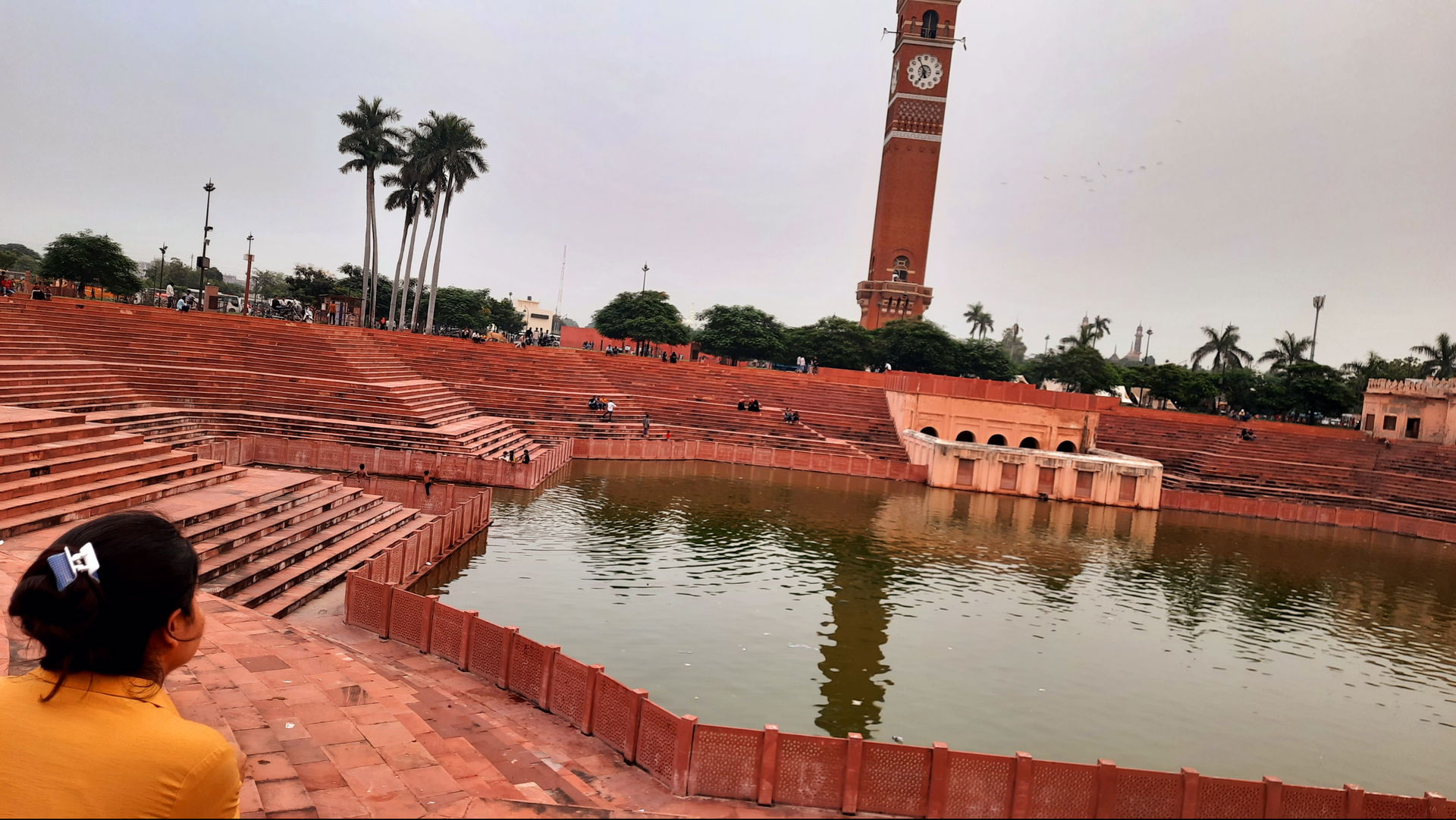 Clock tower of Lucknow that had a gold bird on the top
With a …