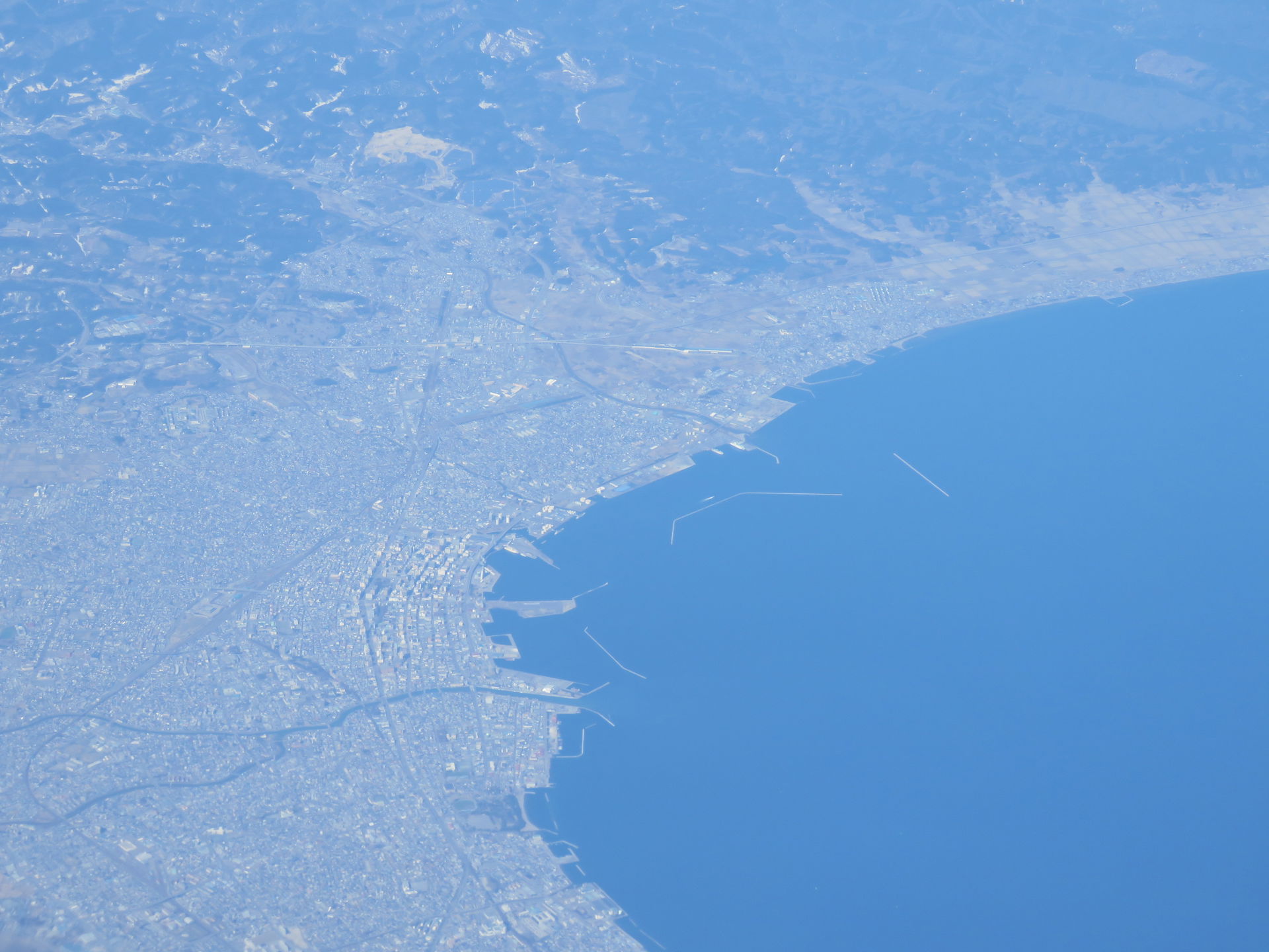 A view of Aomori, Japan, from the air. The view is from the eas…