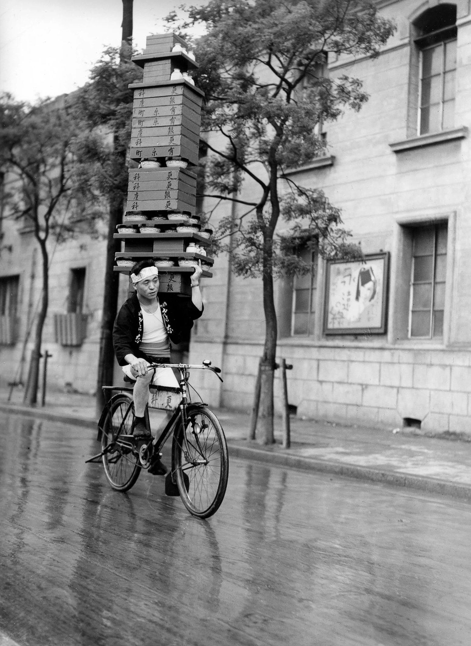 Soba noodles deliveryman in Tokyo, 1935. Piles of soba bowls we…