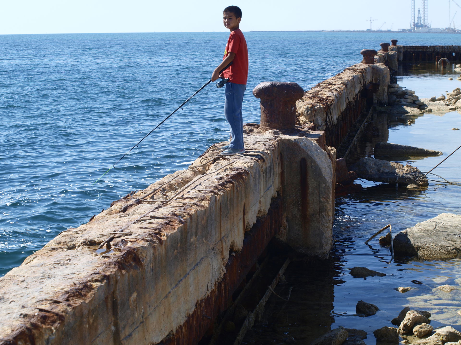 Young fiherman in Aktau by Caspic Sea (Kazakhstan, 2016)