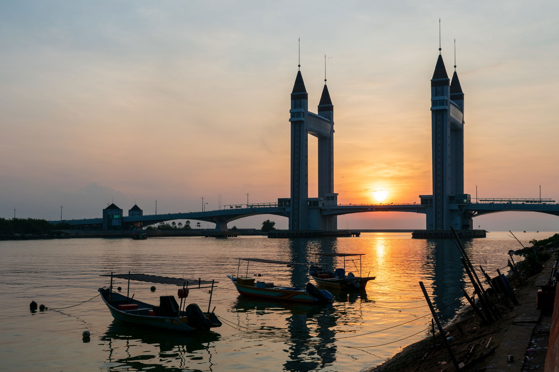 Sun rising between the two towers of the Kuala Terengganu Drawb…