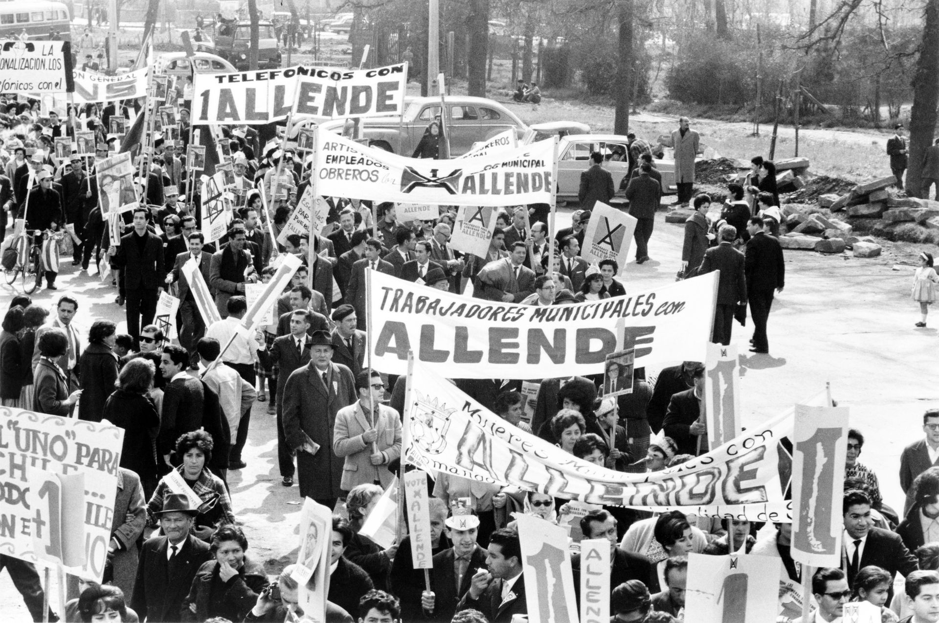 Marchers for Salvador Allende. A crowd of people marching to su…