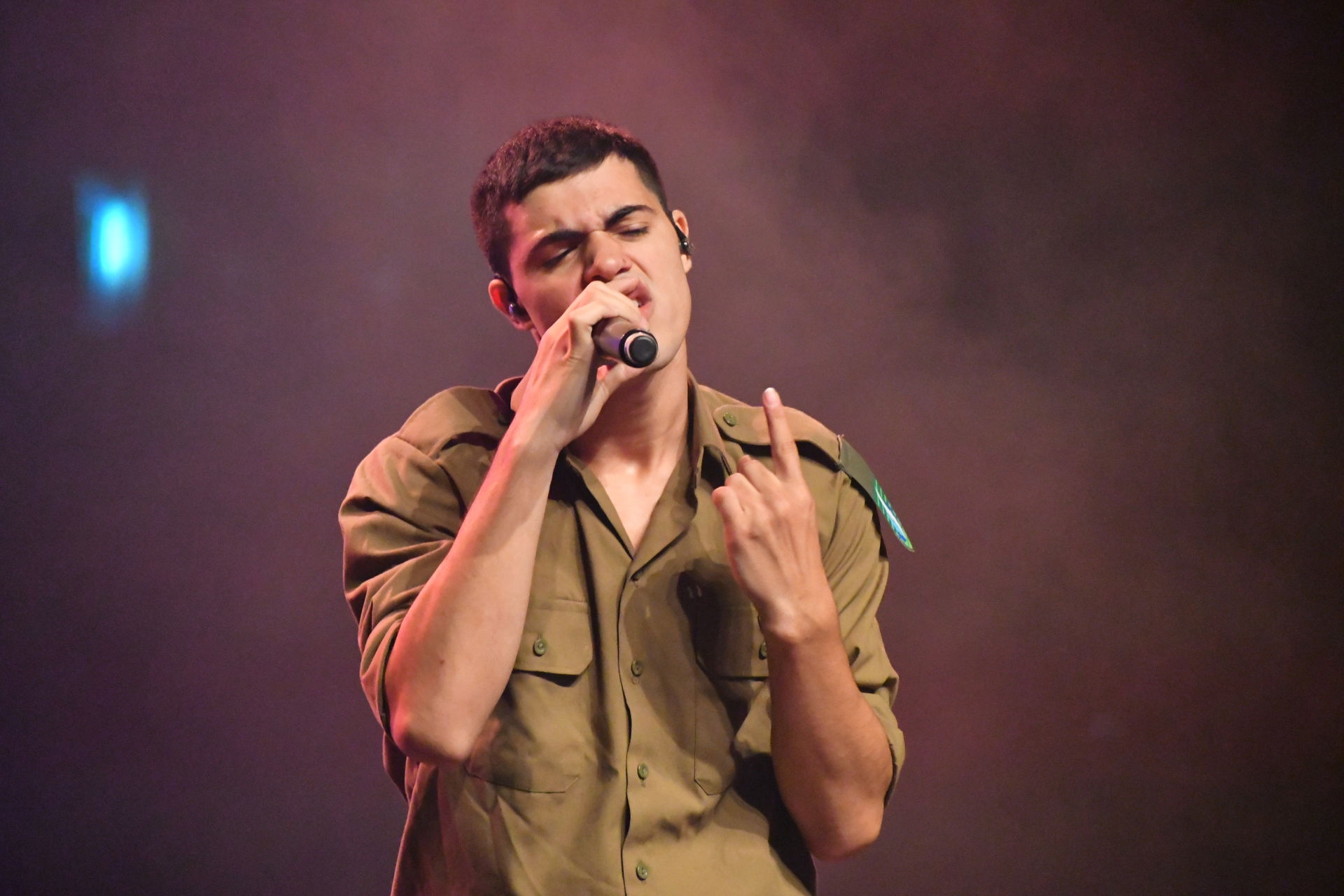 Singer Jonathan Margui performs in front of soldiers at the Air…
